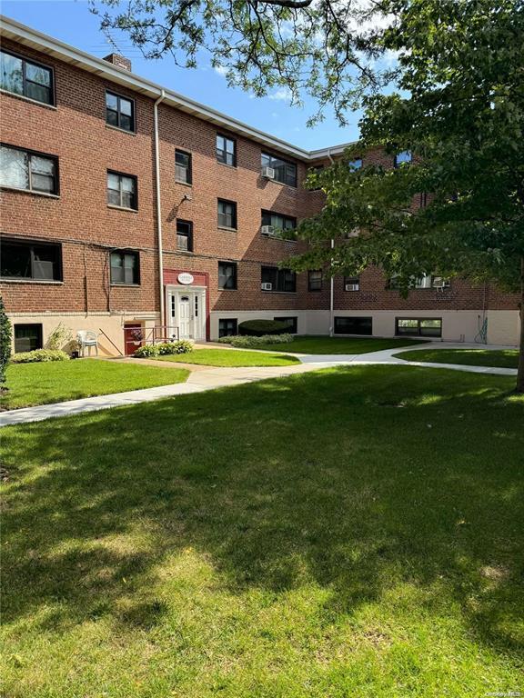 View of community featuring a yard