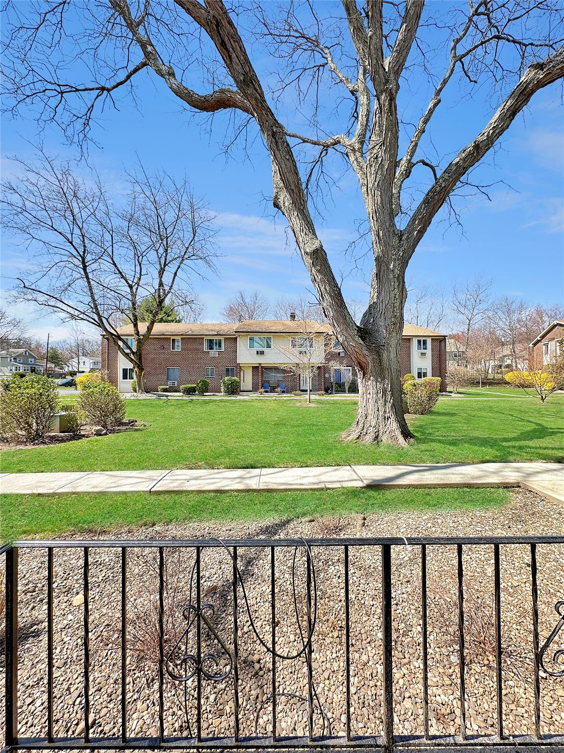 View of complex lawn and a residential view