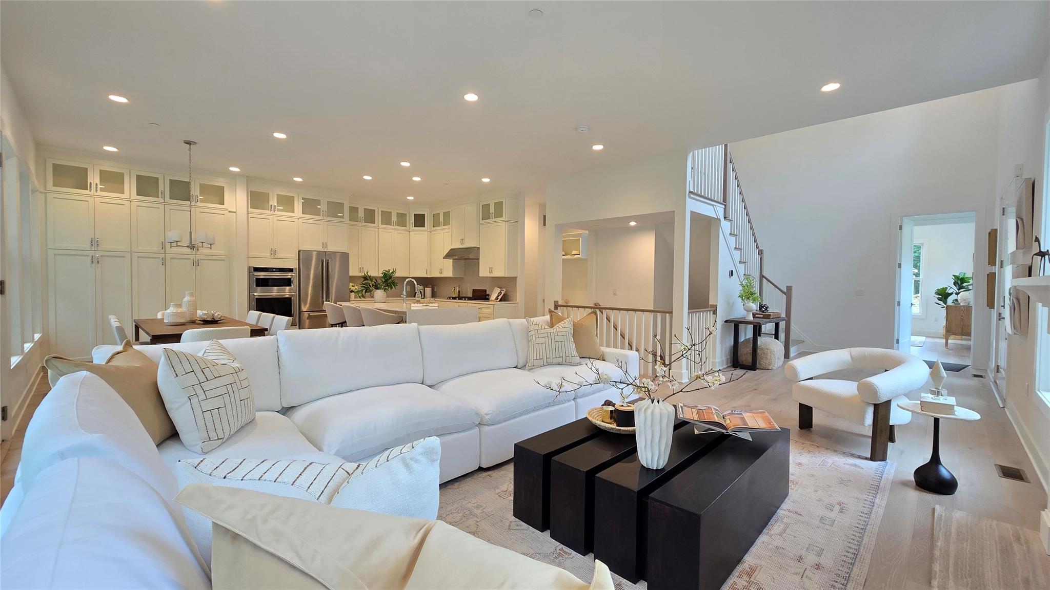 Actual photo of Living room featuring recessed lighting and light wood-style flooring
