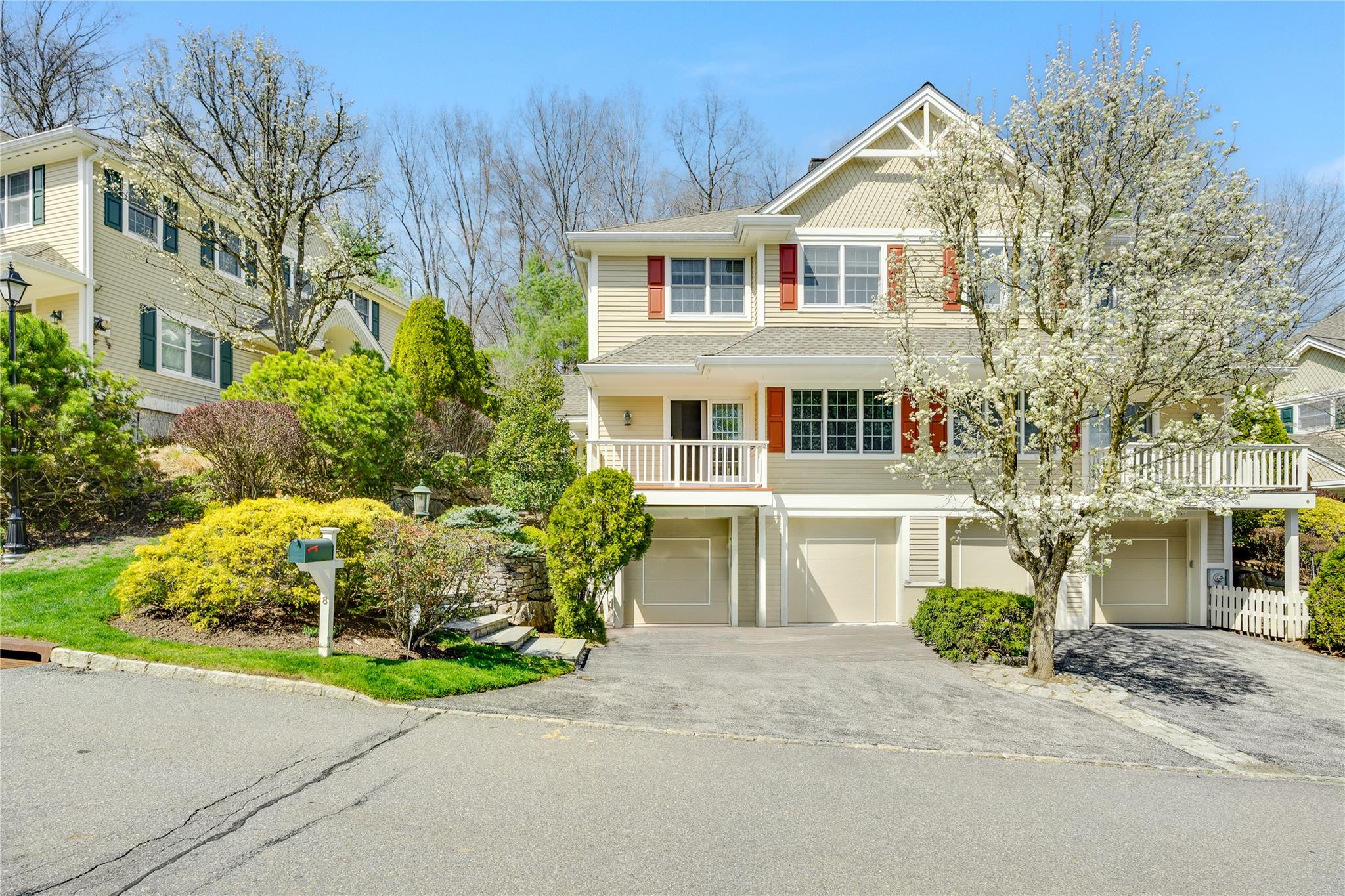 View of front facade featuring concrete driveway and a garage