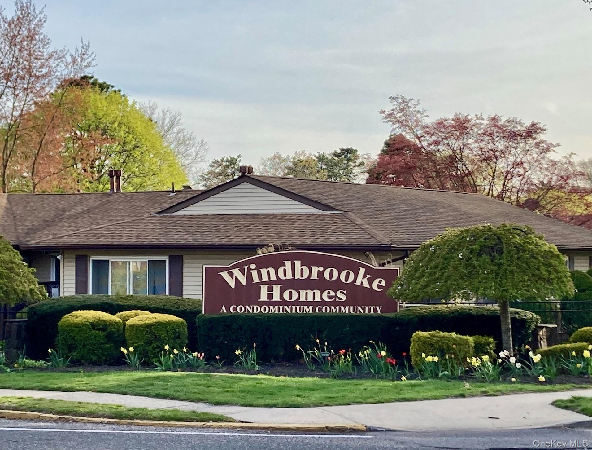 Community sign featuring a lawn