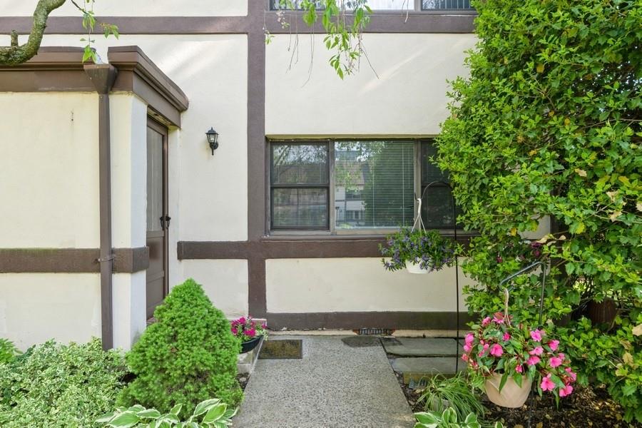 View of exterior entry with stucco siding