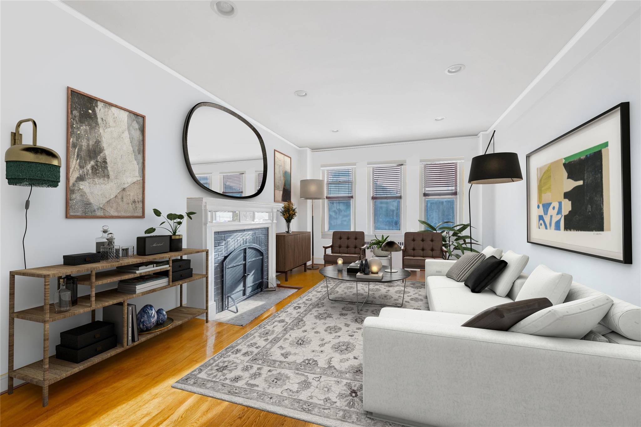 Living area featuring wood finished floors, a fireplace with flush hearth, and recessed lighting