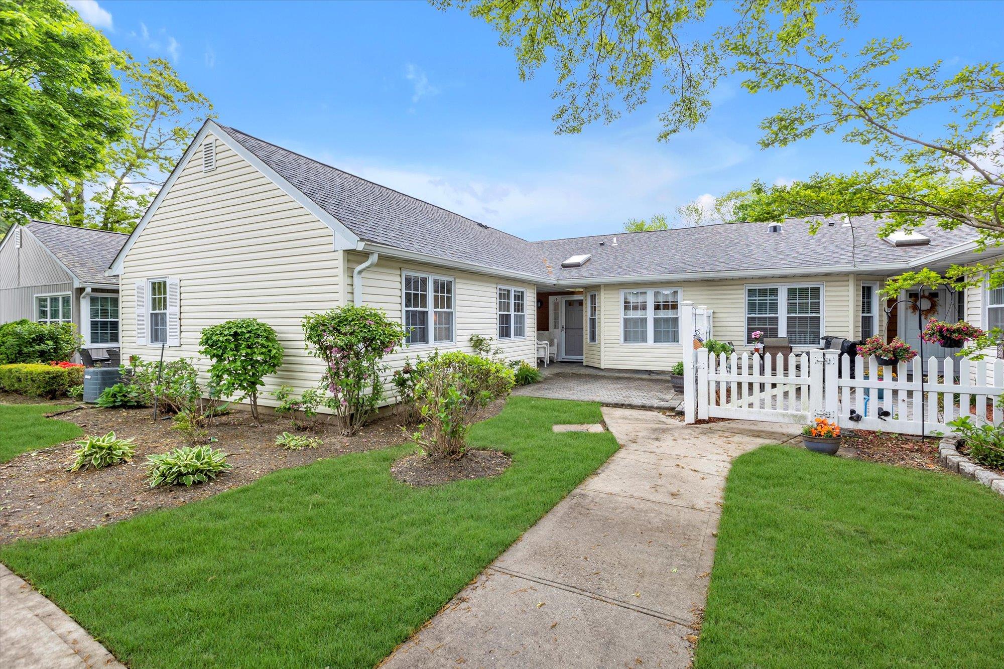 Single story home featuring roof with shingles and central AC unit