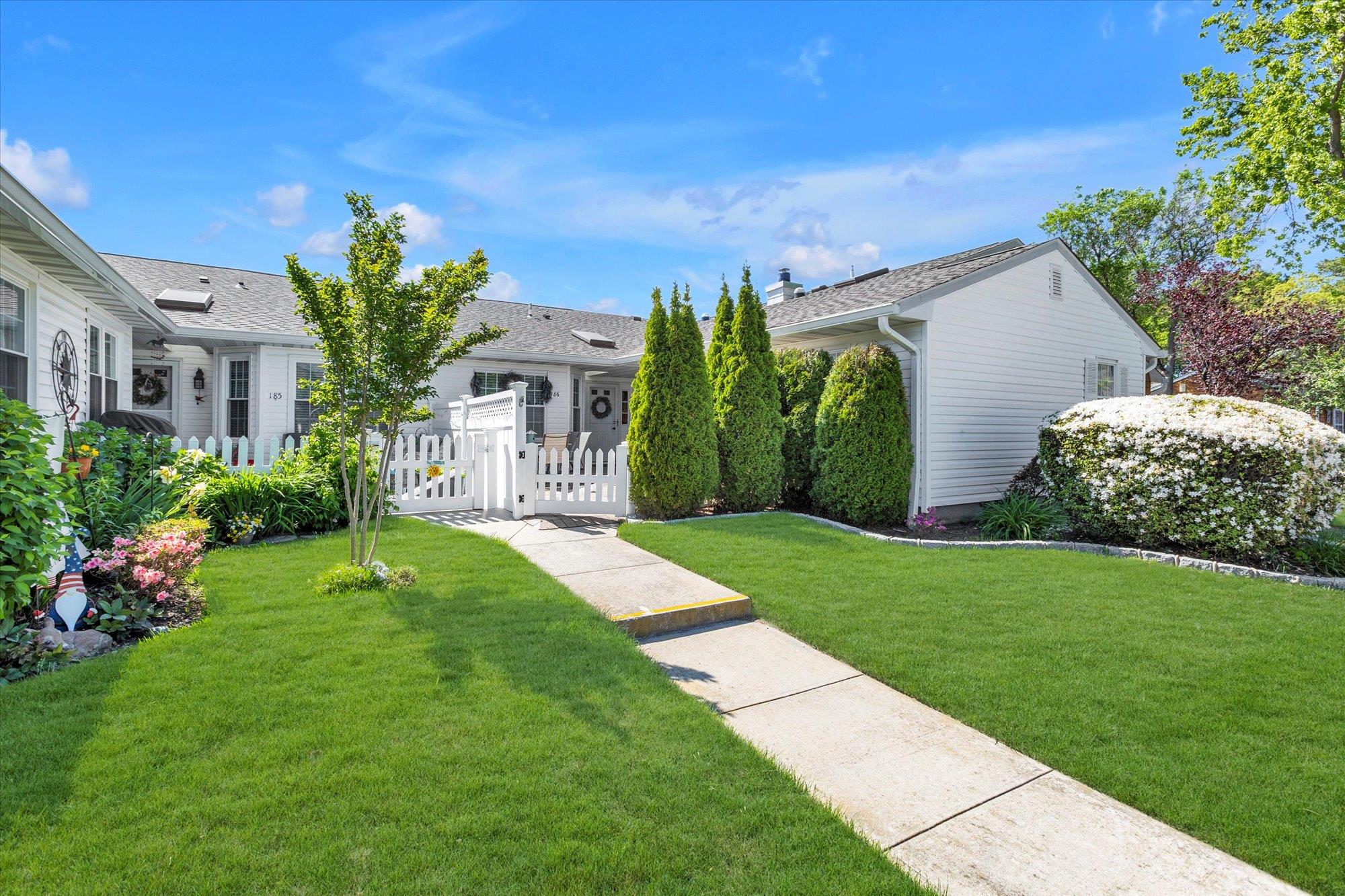 Ranch-style home with a gate