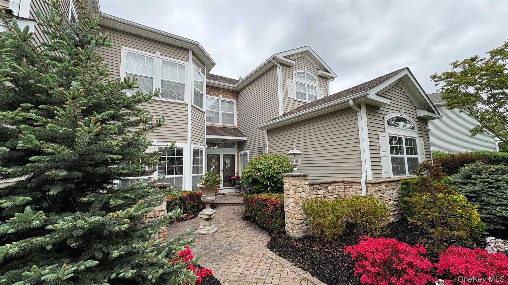 View of front of house featuring stone siding