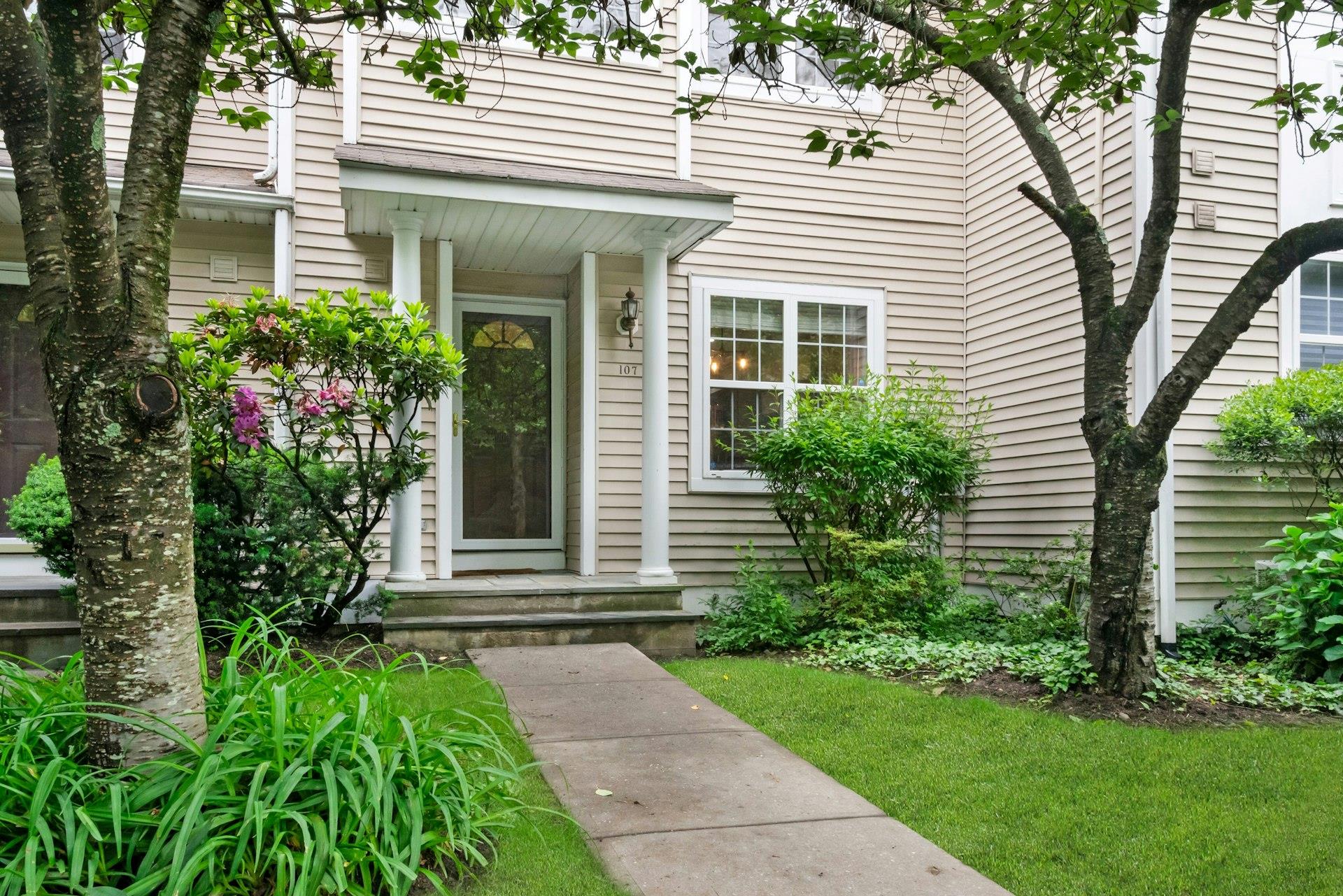 Welcome to 107 Glenwood Drive. Step right into your townhome with covered front porch.