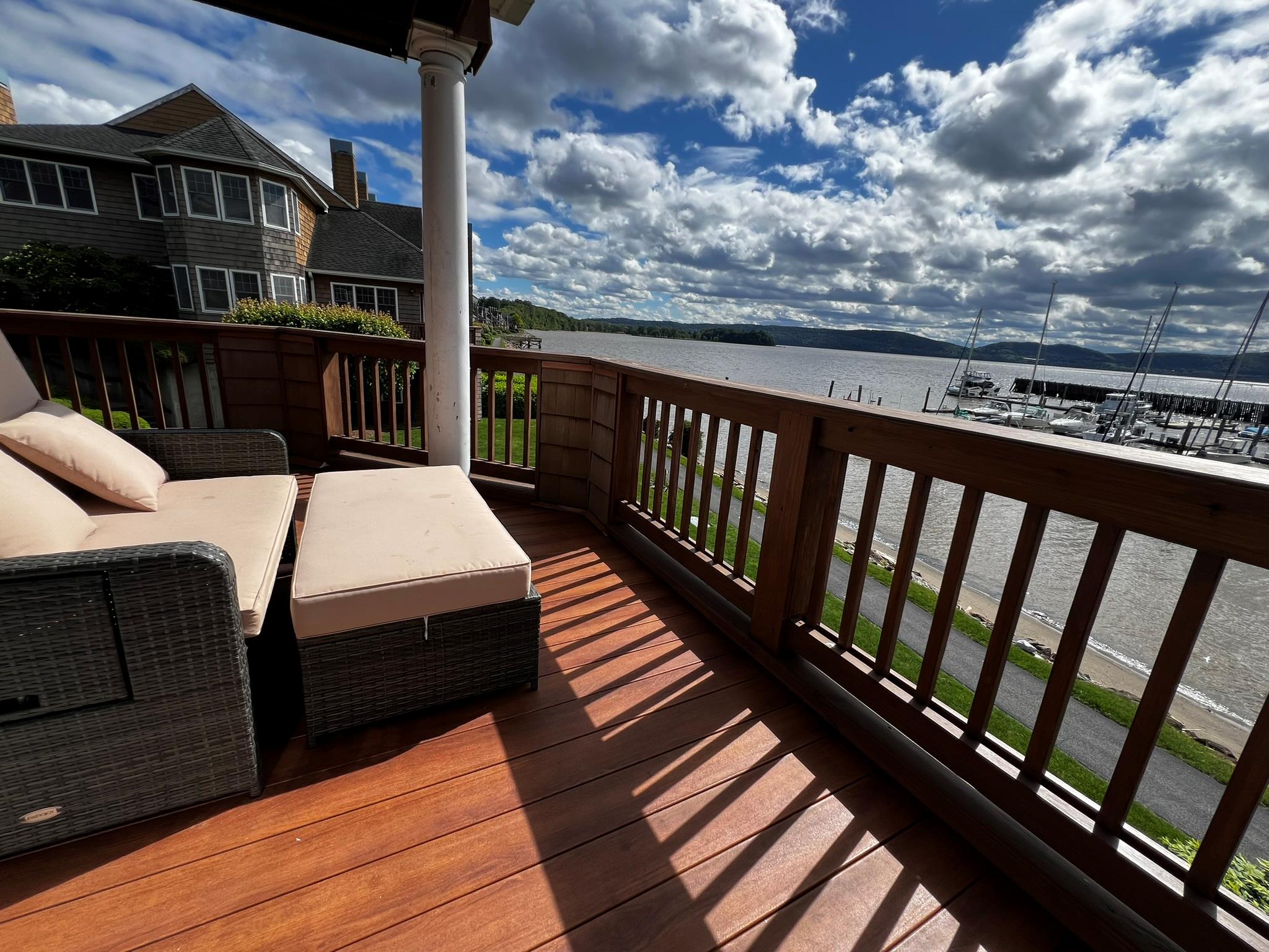 Enjoy stunning marina views every day from your wraparound deck with 180 degree river view