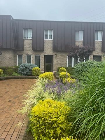Front exterior, brick entry
