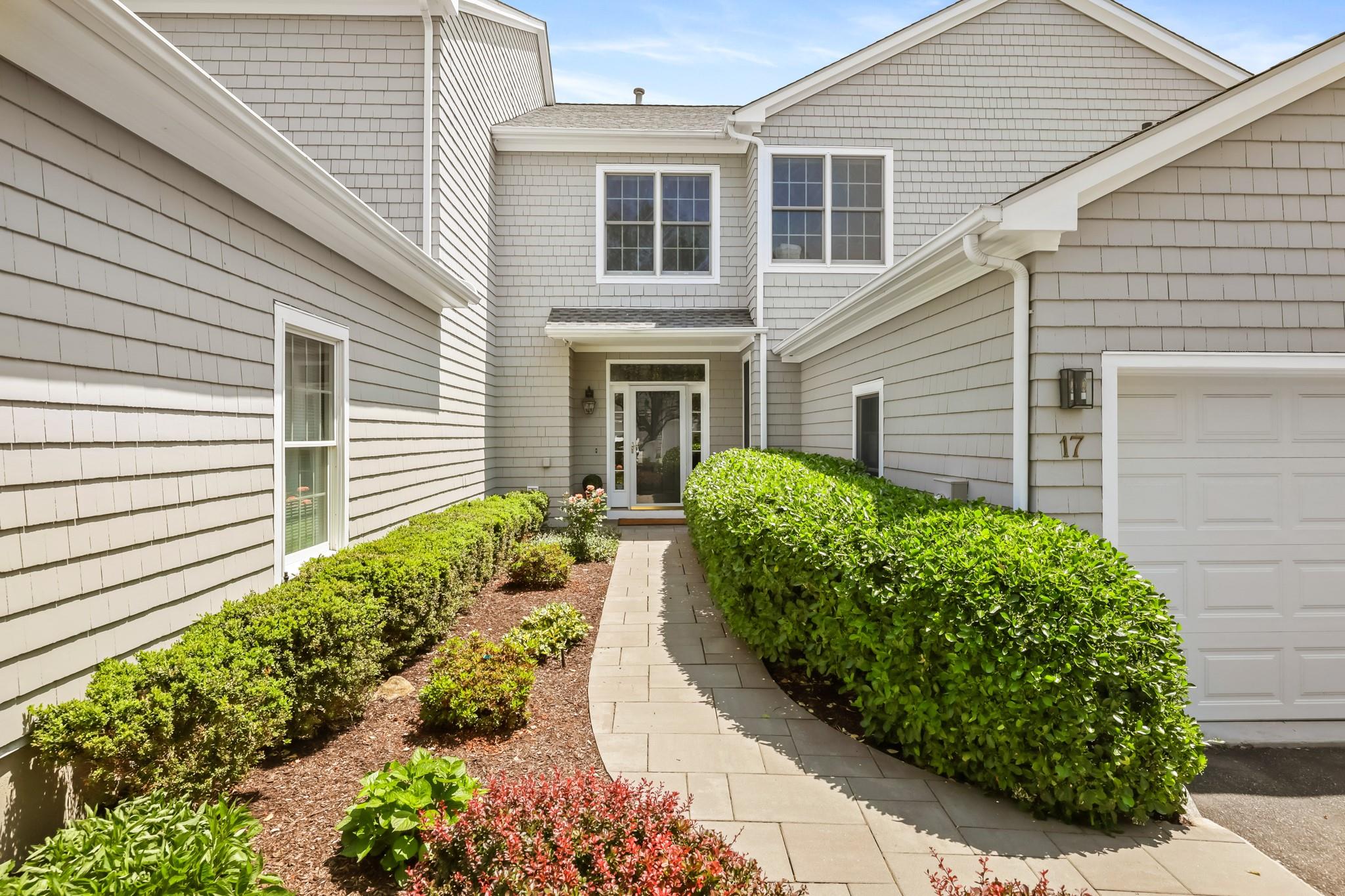 Doorway to property with a garage