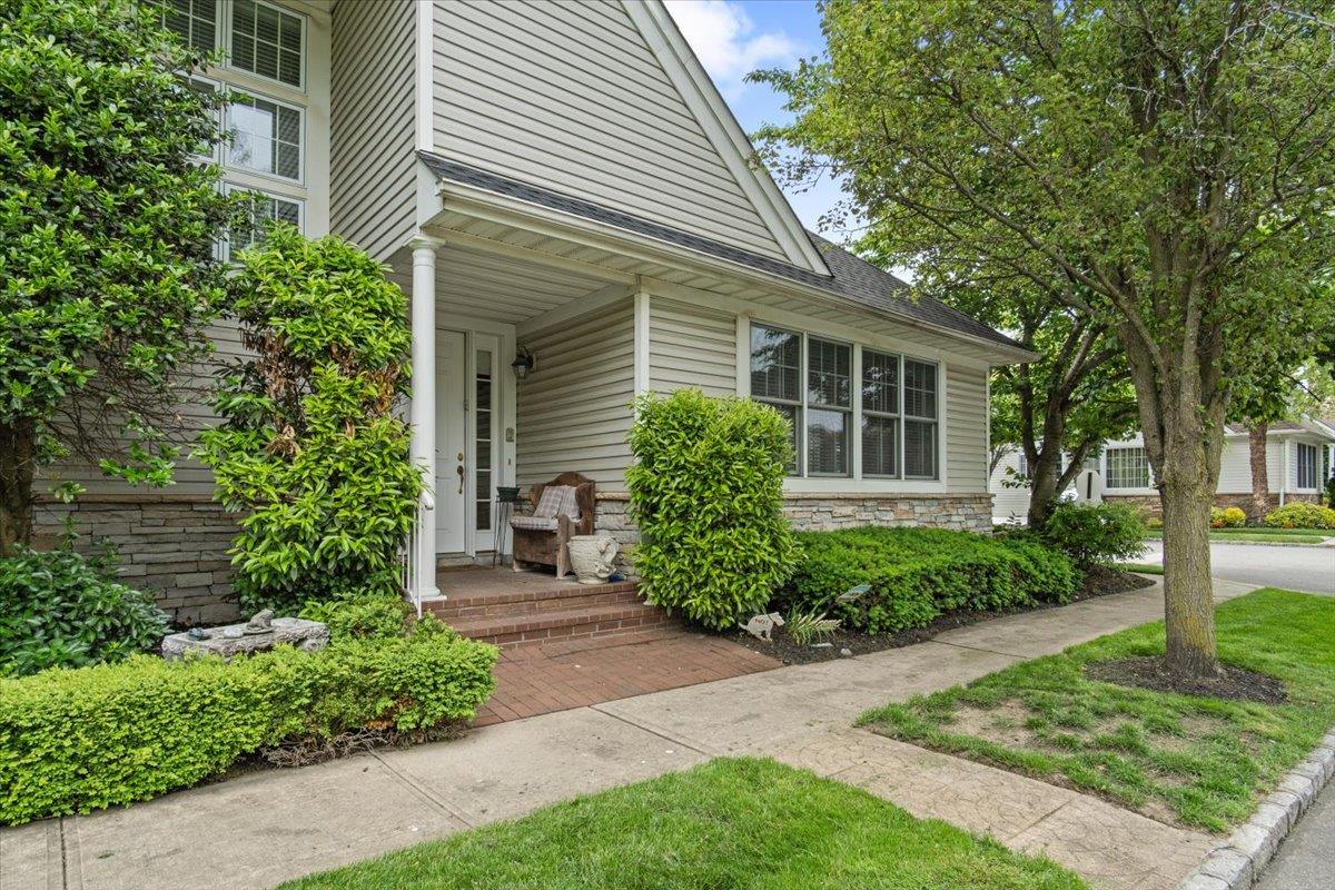 View of exterior entry featuring stone siding