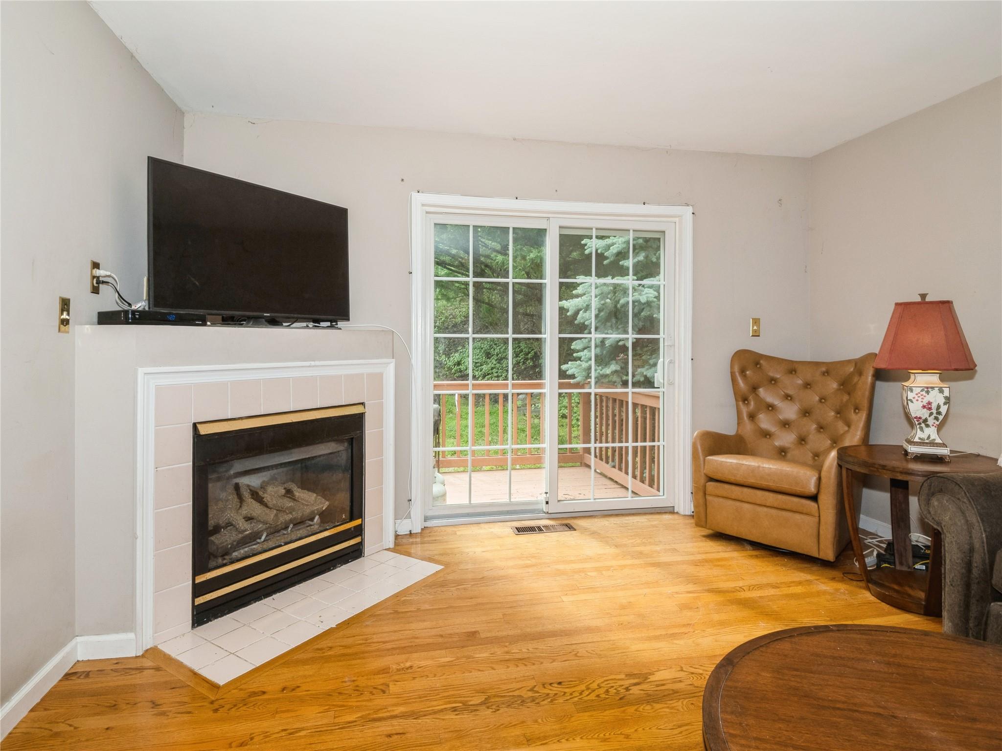 Living area with hard wood  floors and gas fireplace