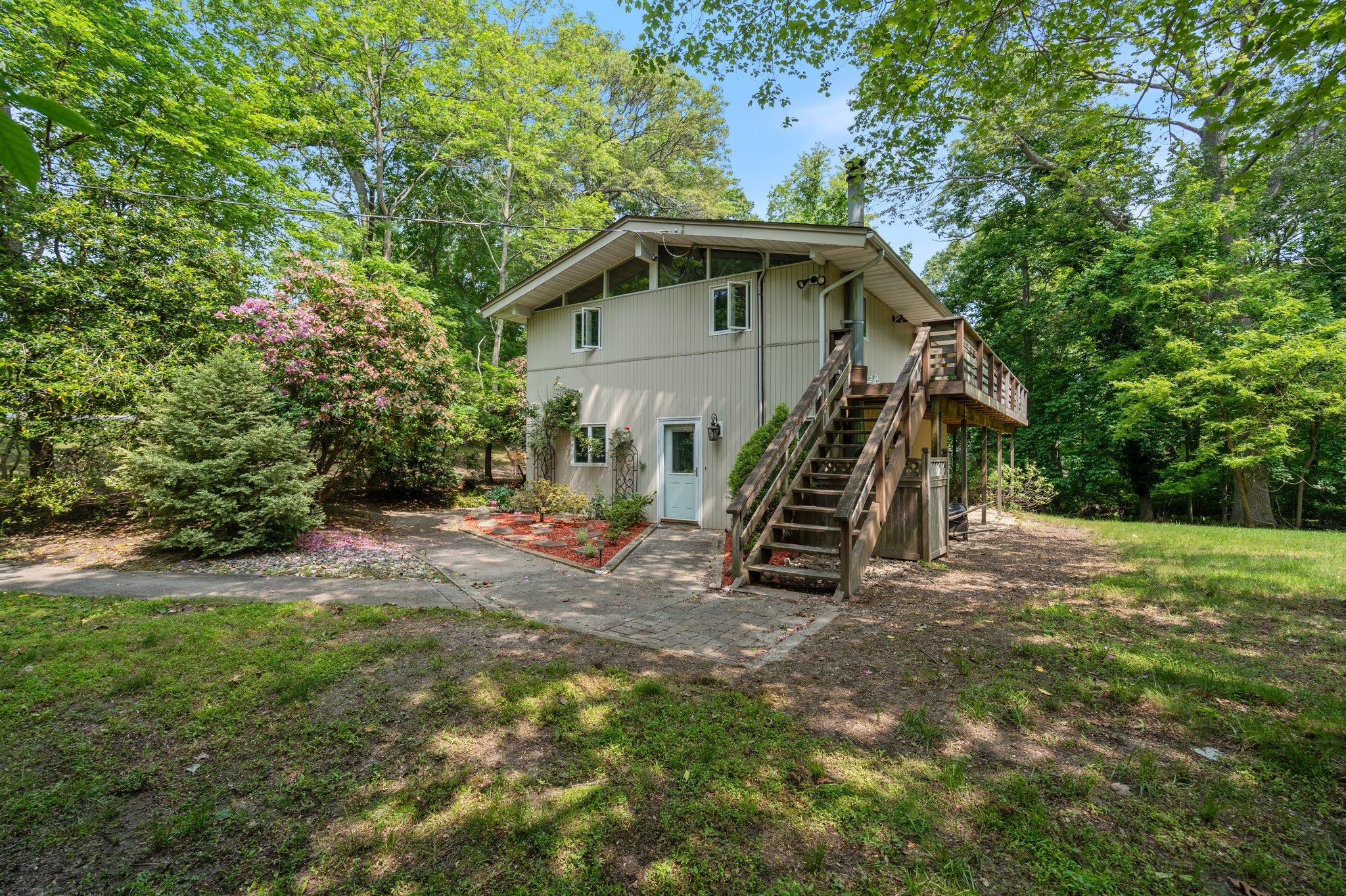 Rear view of house with stairs