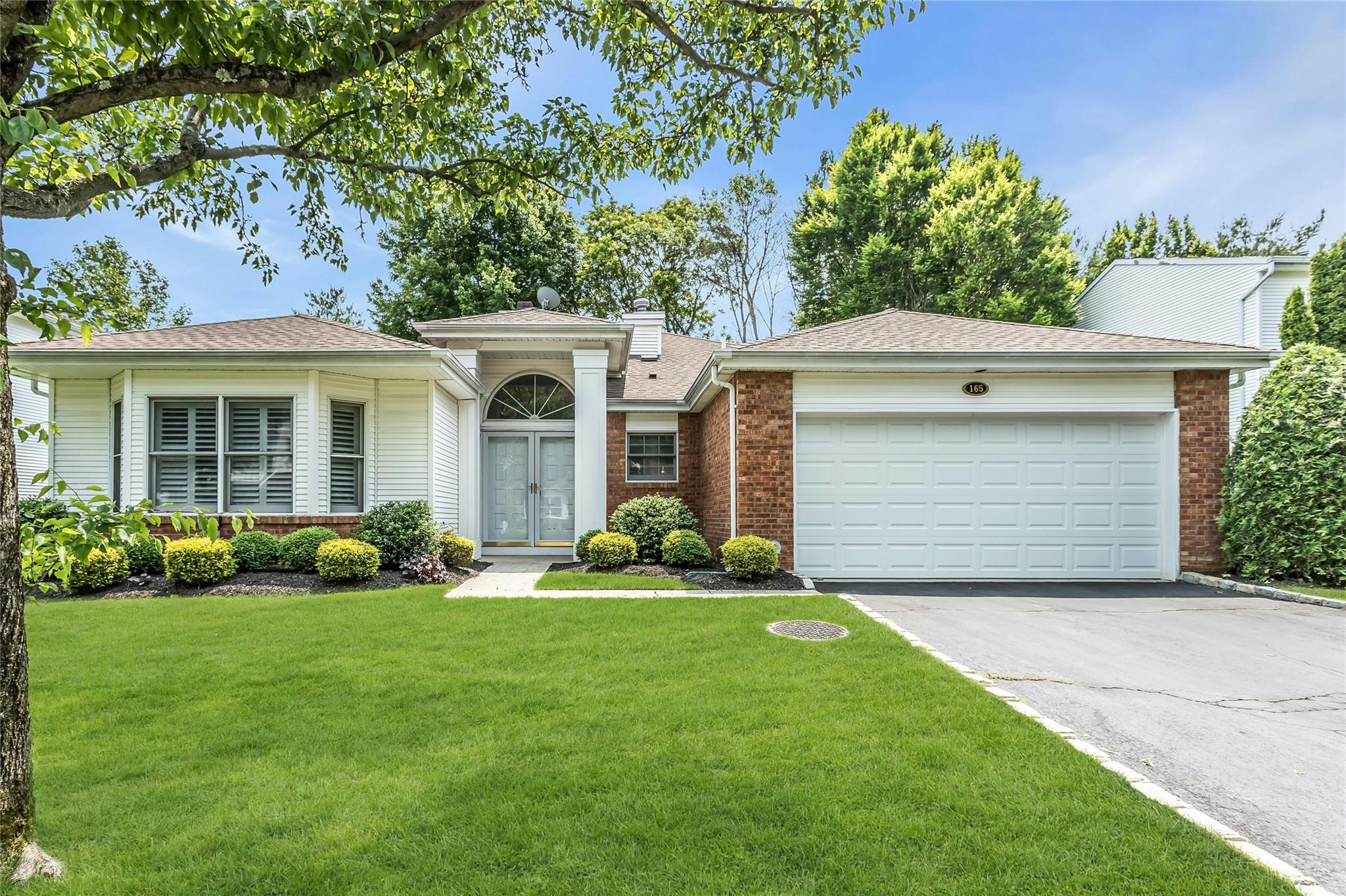 Ranch-style home featuring Great Curb Appeal with an Attached Two Car Garage