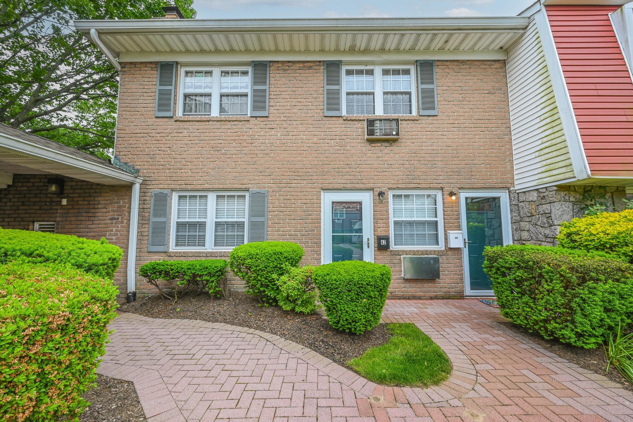 View of front facade featuring brick siding