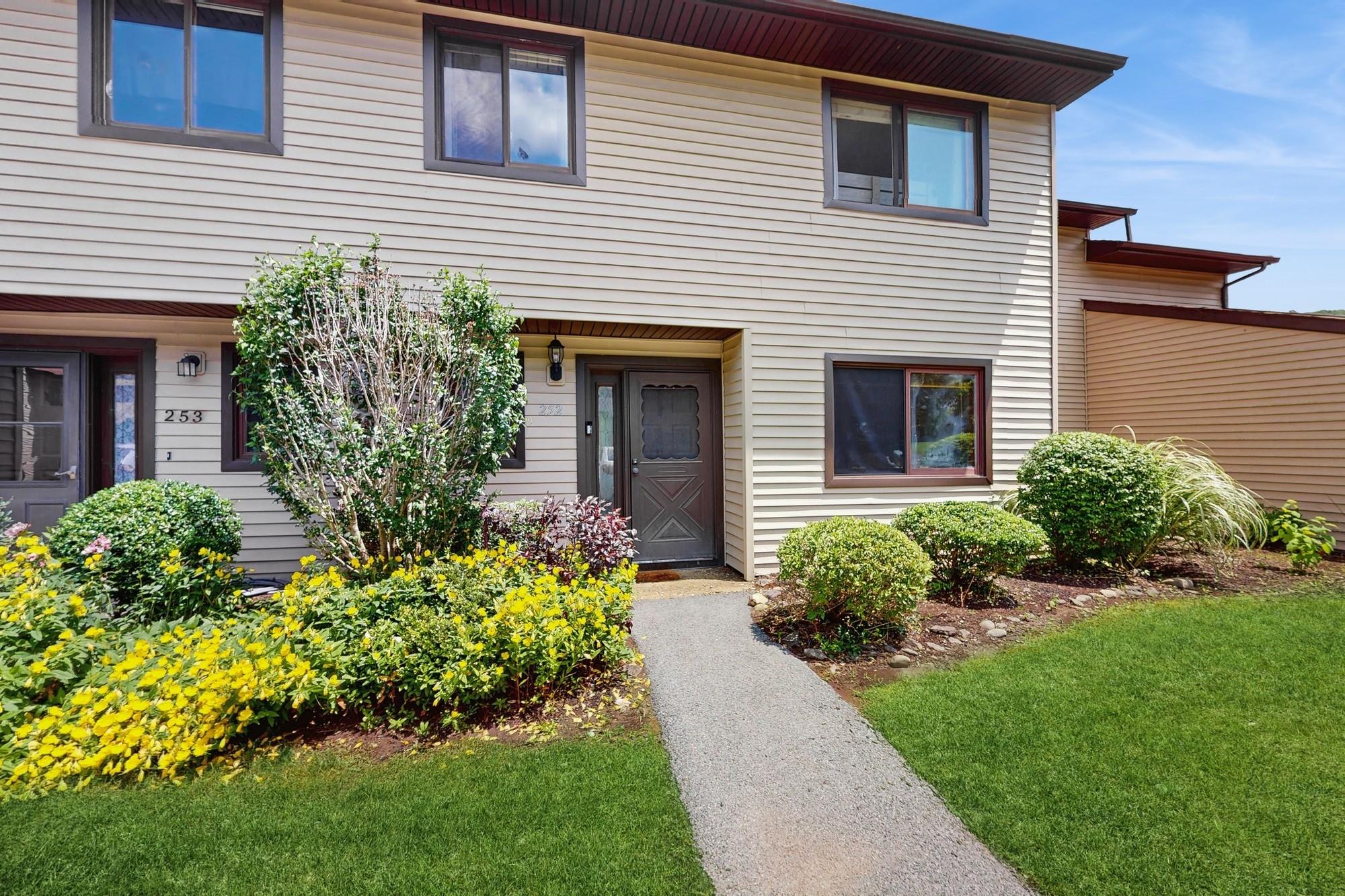 View of property featuring a front yard
