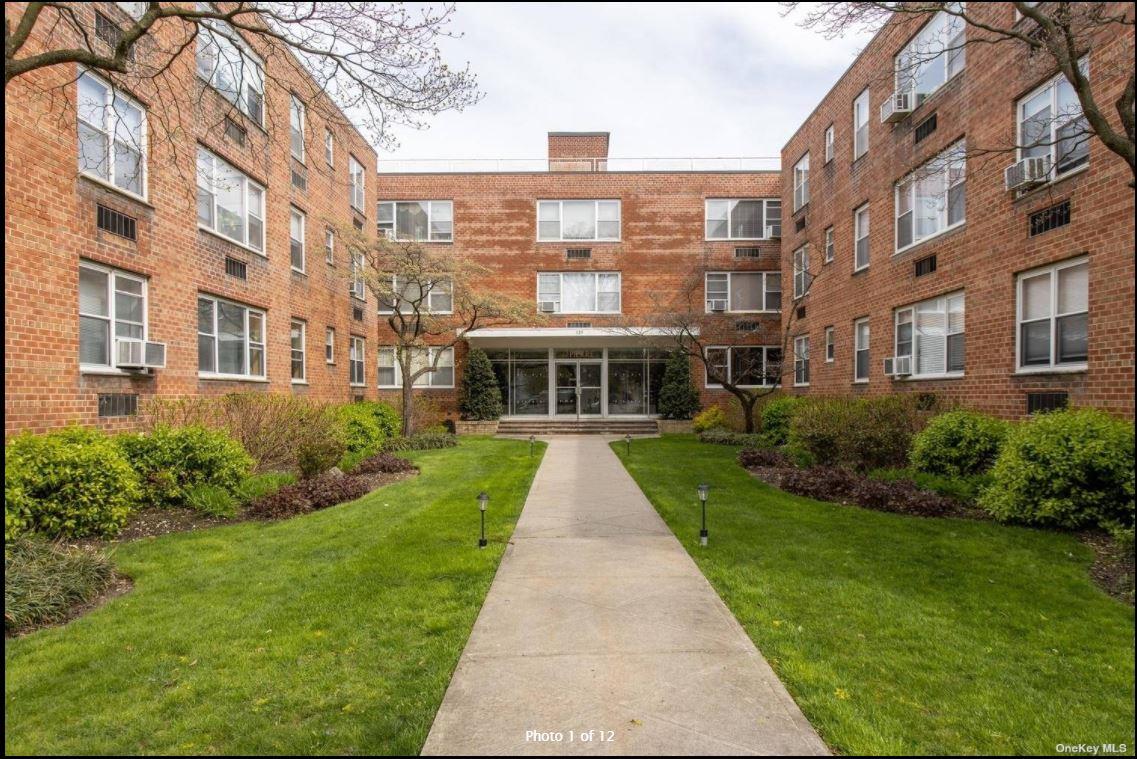 View of apartment building / complex with cooling unit