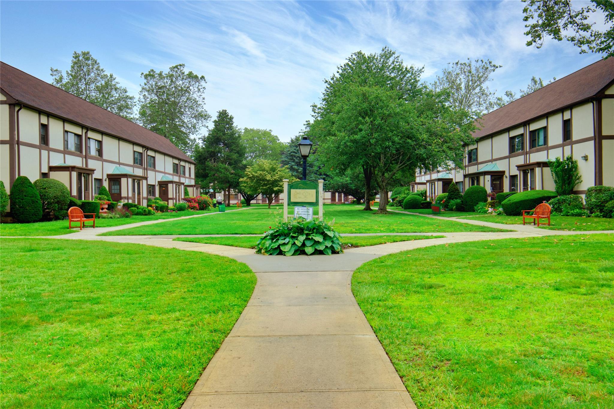 View of community featuring a residential view and a yard