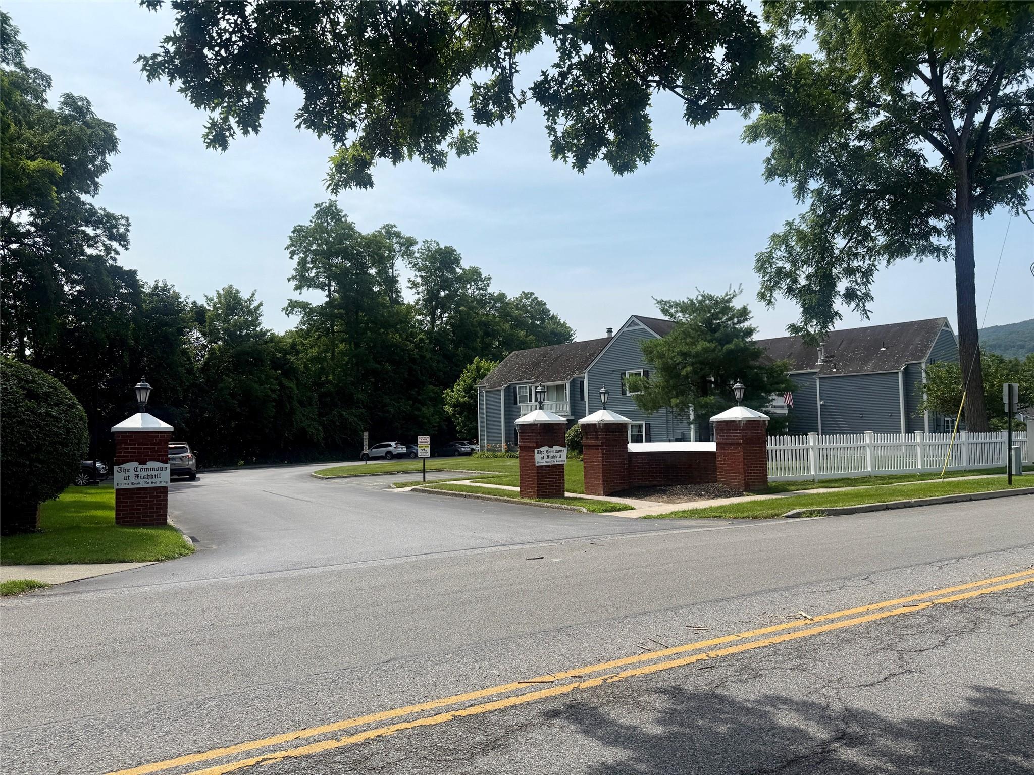 View of asphalt road with sidewalks