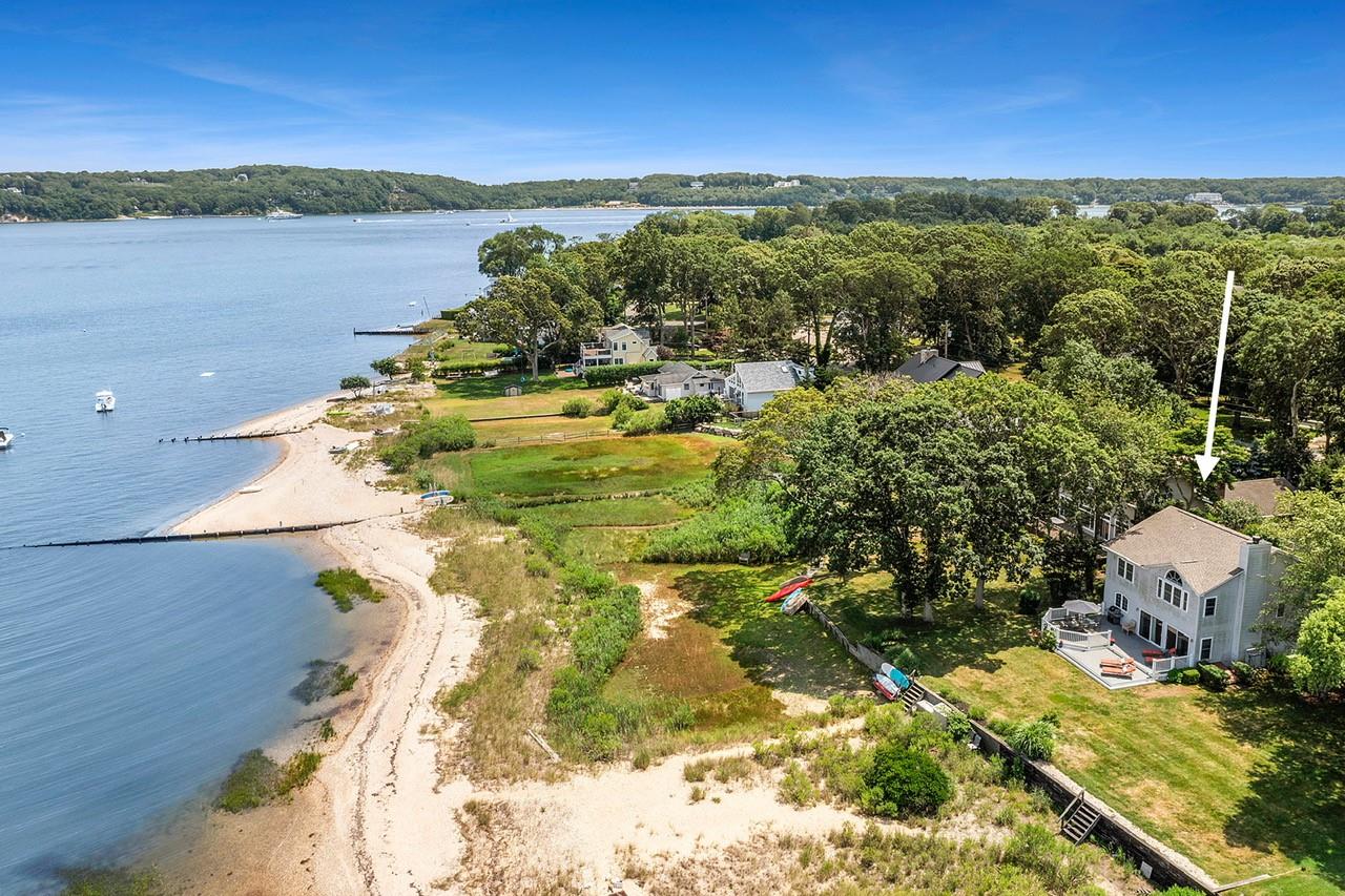 Aerial View of Bayfront home with beach