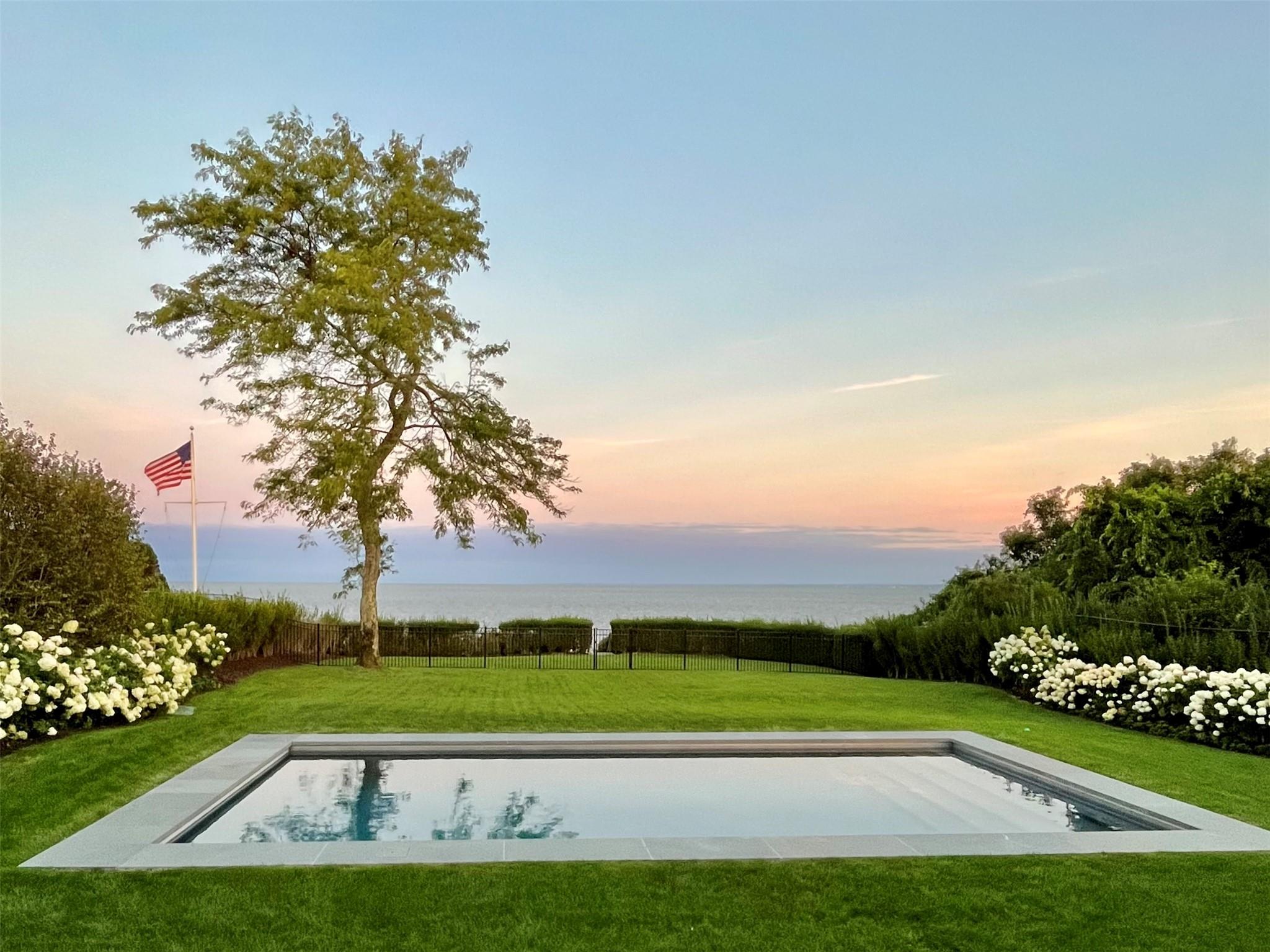 View of pool with a water view
