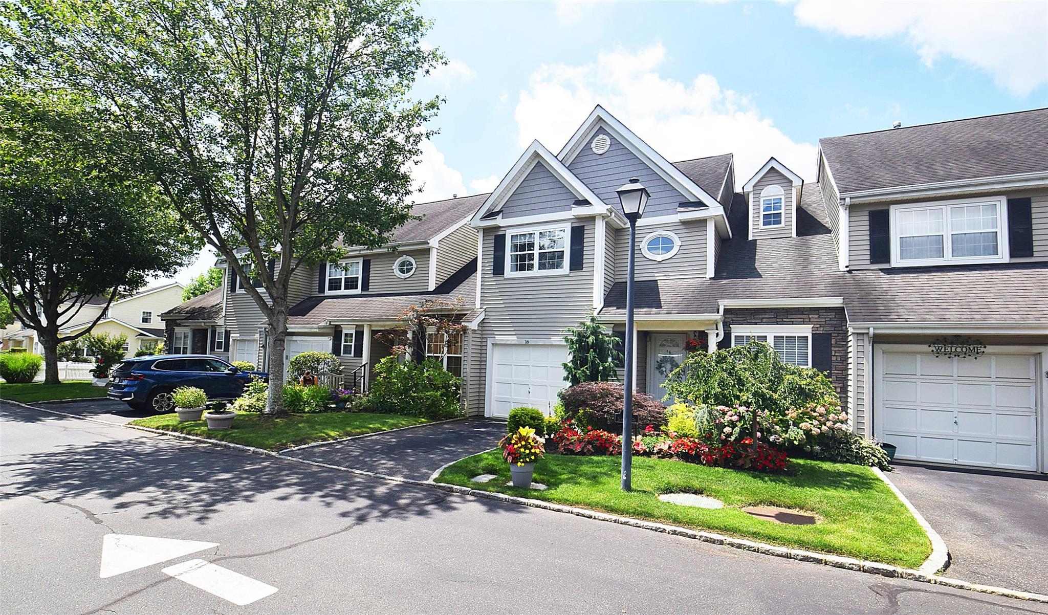 Traditional-style home featuring driveway and an attached garage
