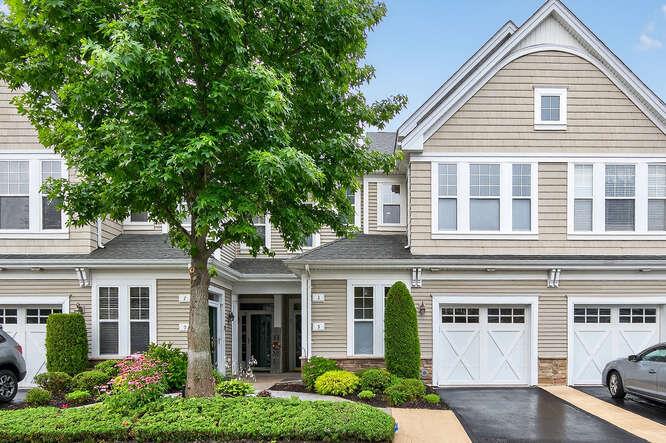 View of front of house featuring a garage and driveway