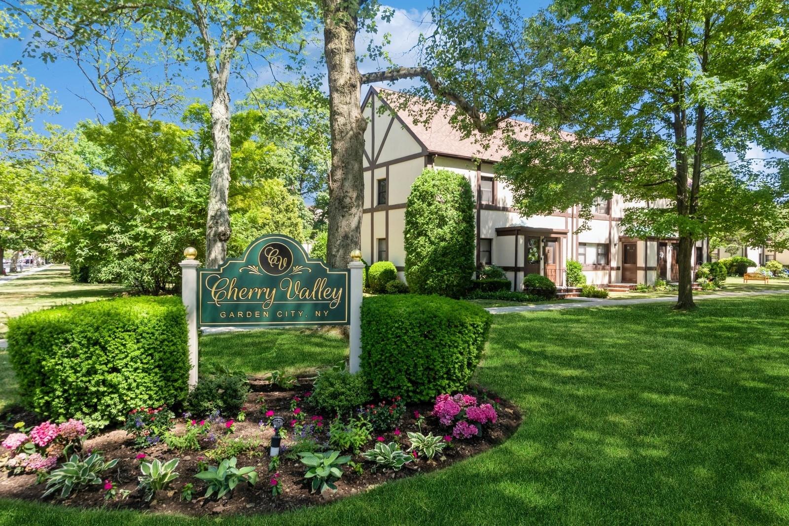 Community sign featuring a lawn
