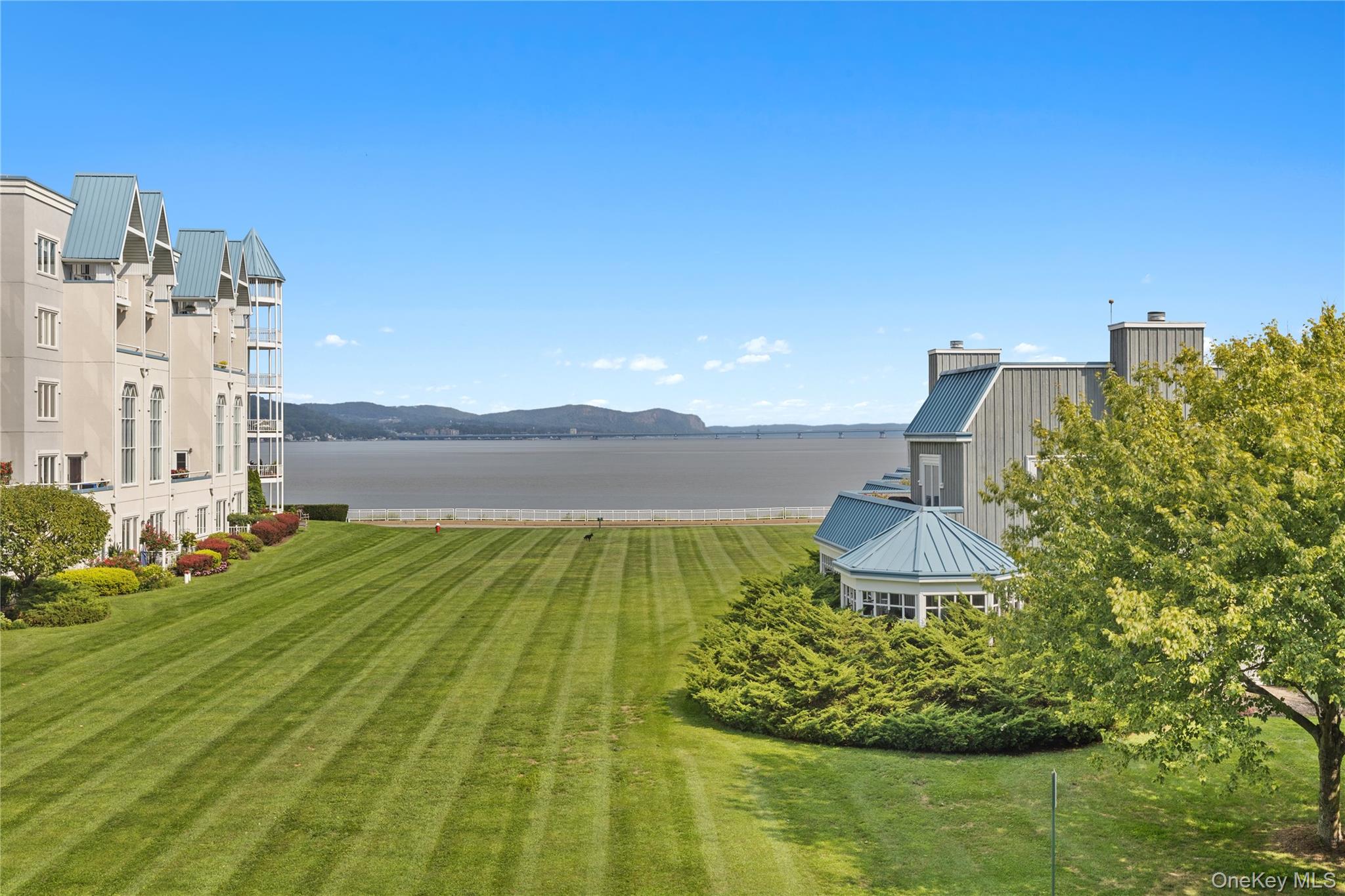 The view from 103 Gair Street across the common green to the Hudson River .