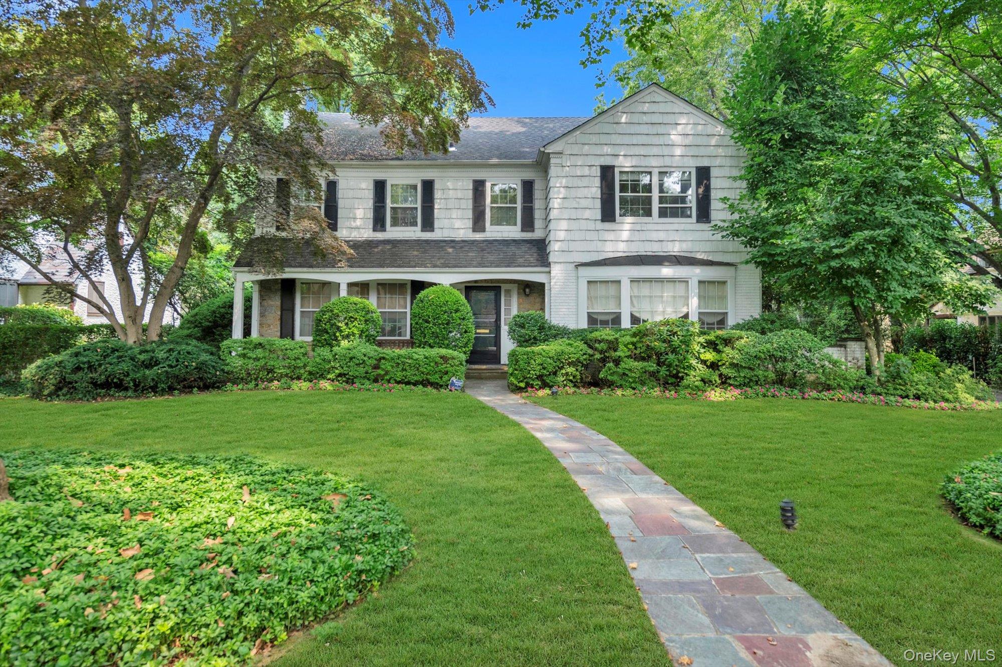 Stunning brick, stone, and cedar shake center hall colonial