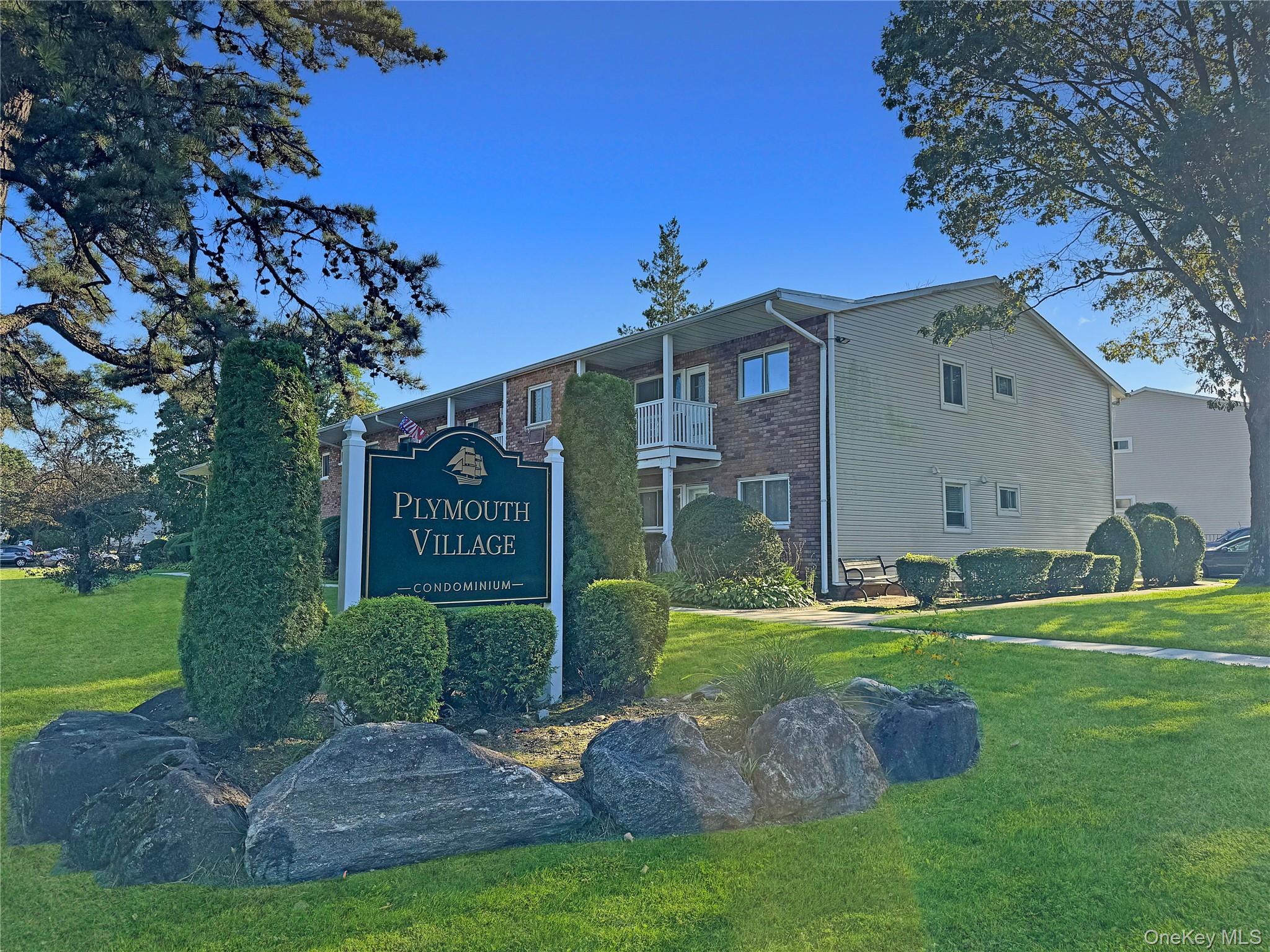 Community sign featuring a yard