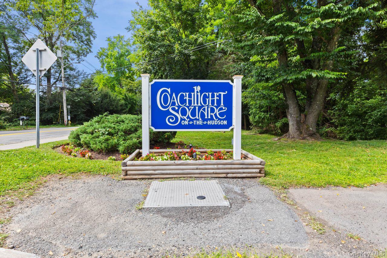Community sign featuring a lawn