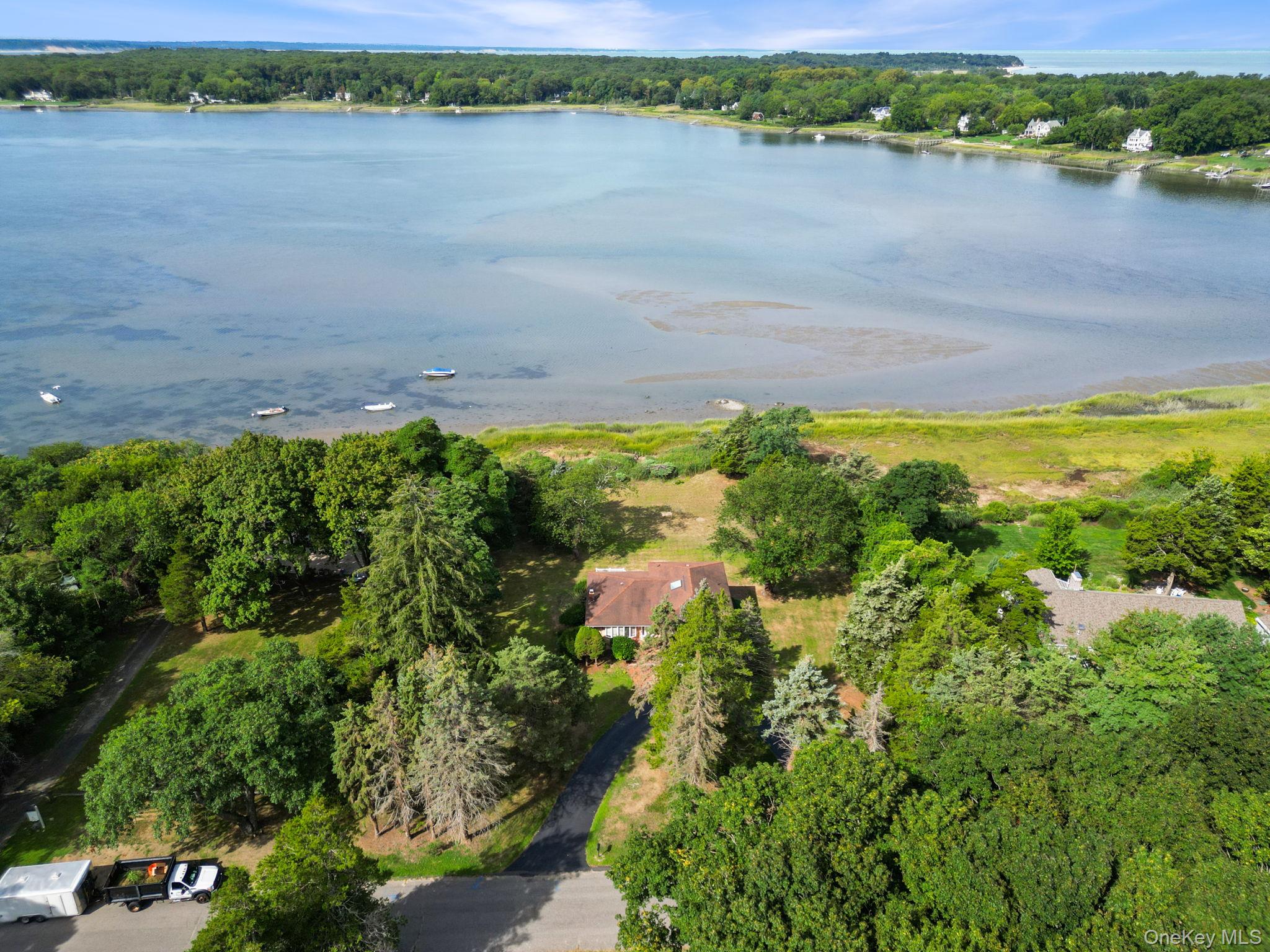 Aerial overview of property's location featuring a large body of water