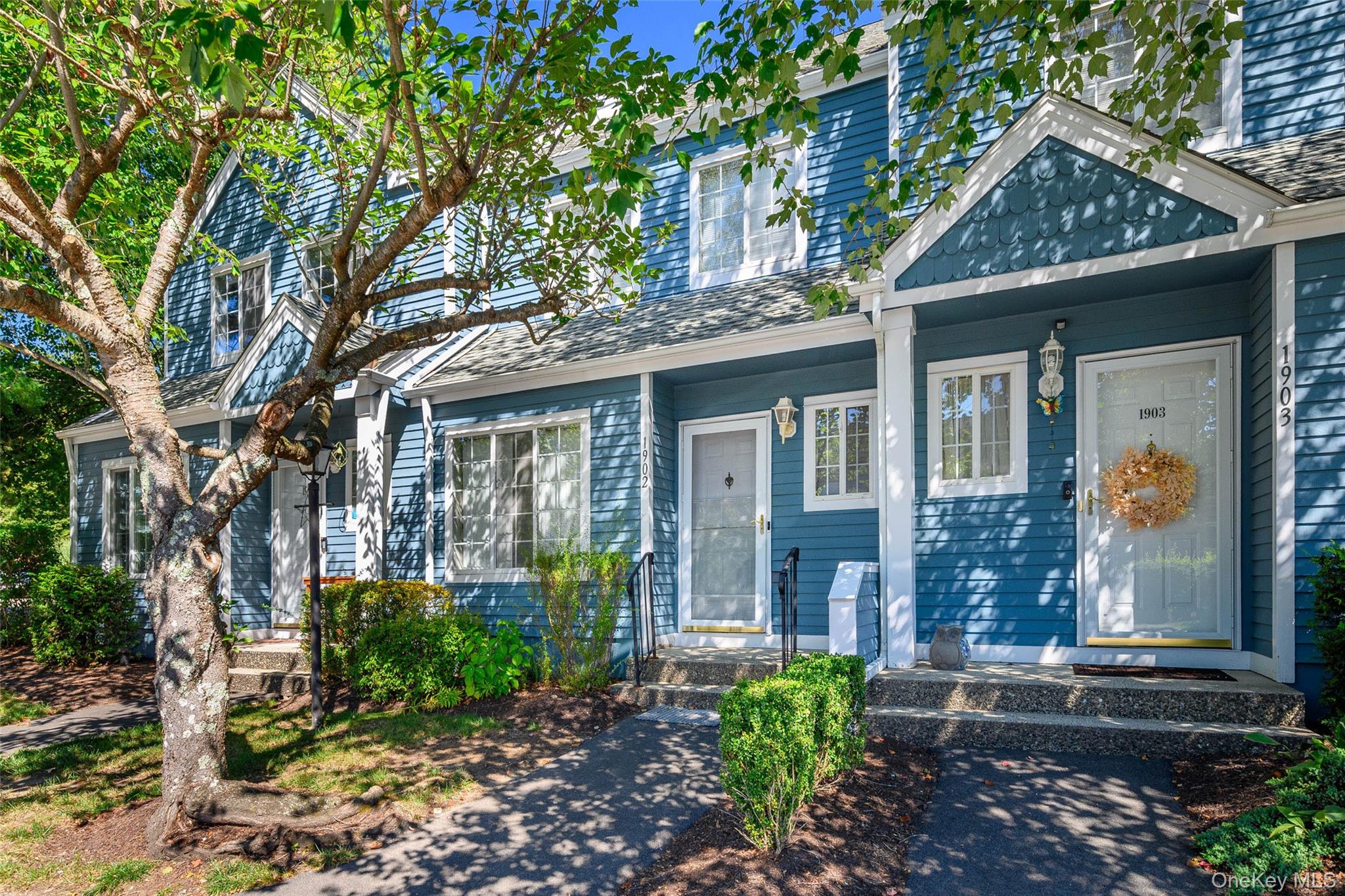 Property entrance featuring roof with shingles