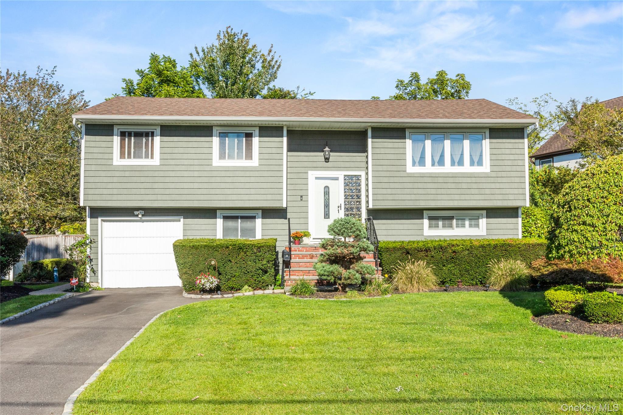 With New Driveway, Bluestone Steps, New Siding on Front 10 years ago
