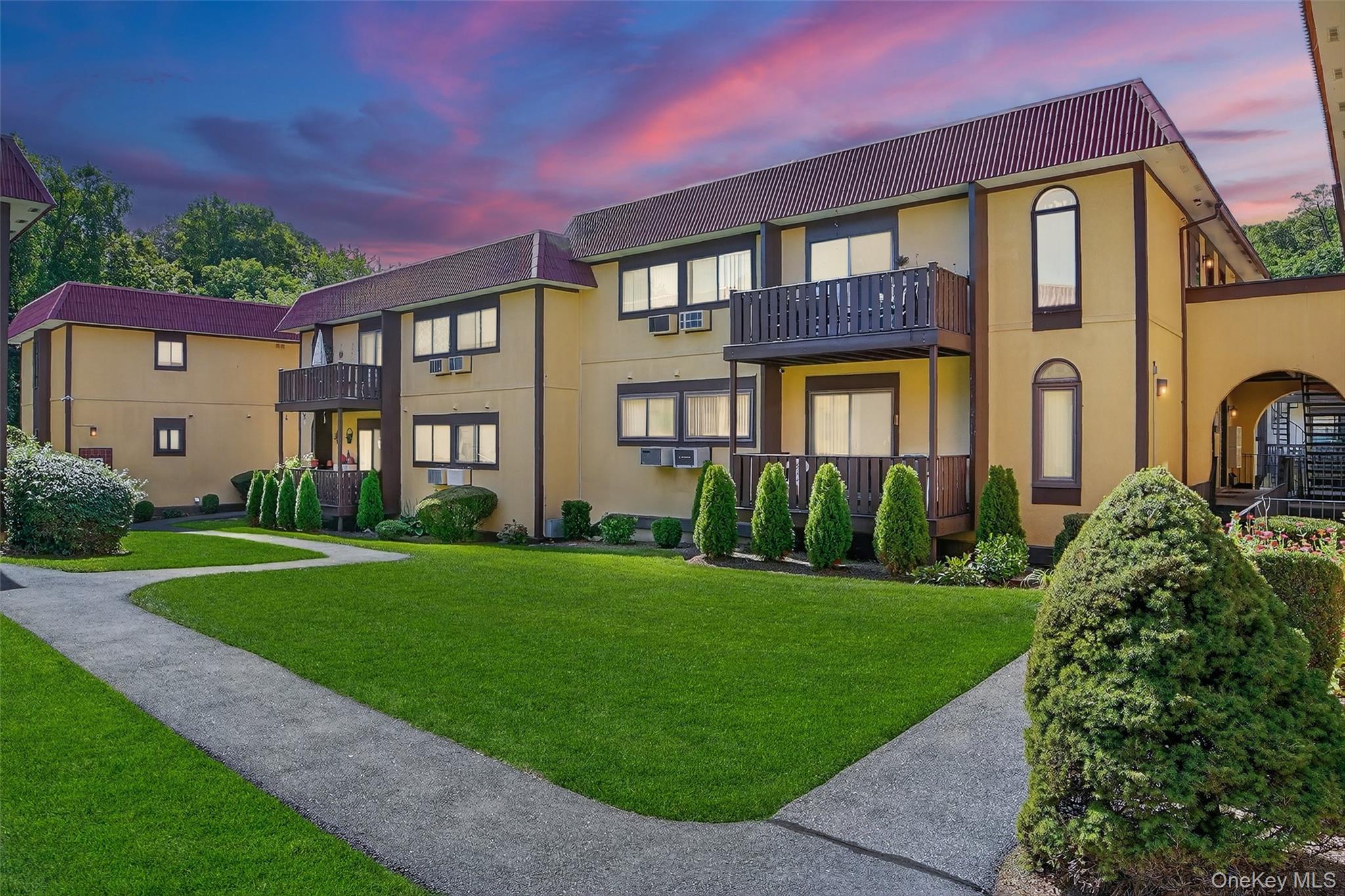 View of property at dusk