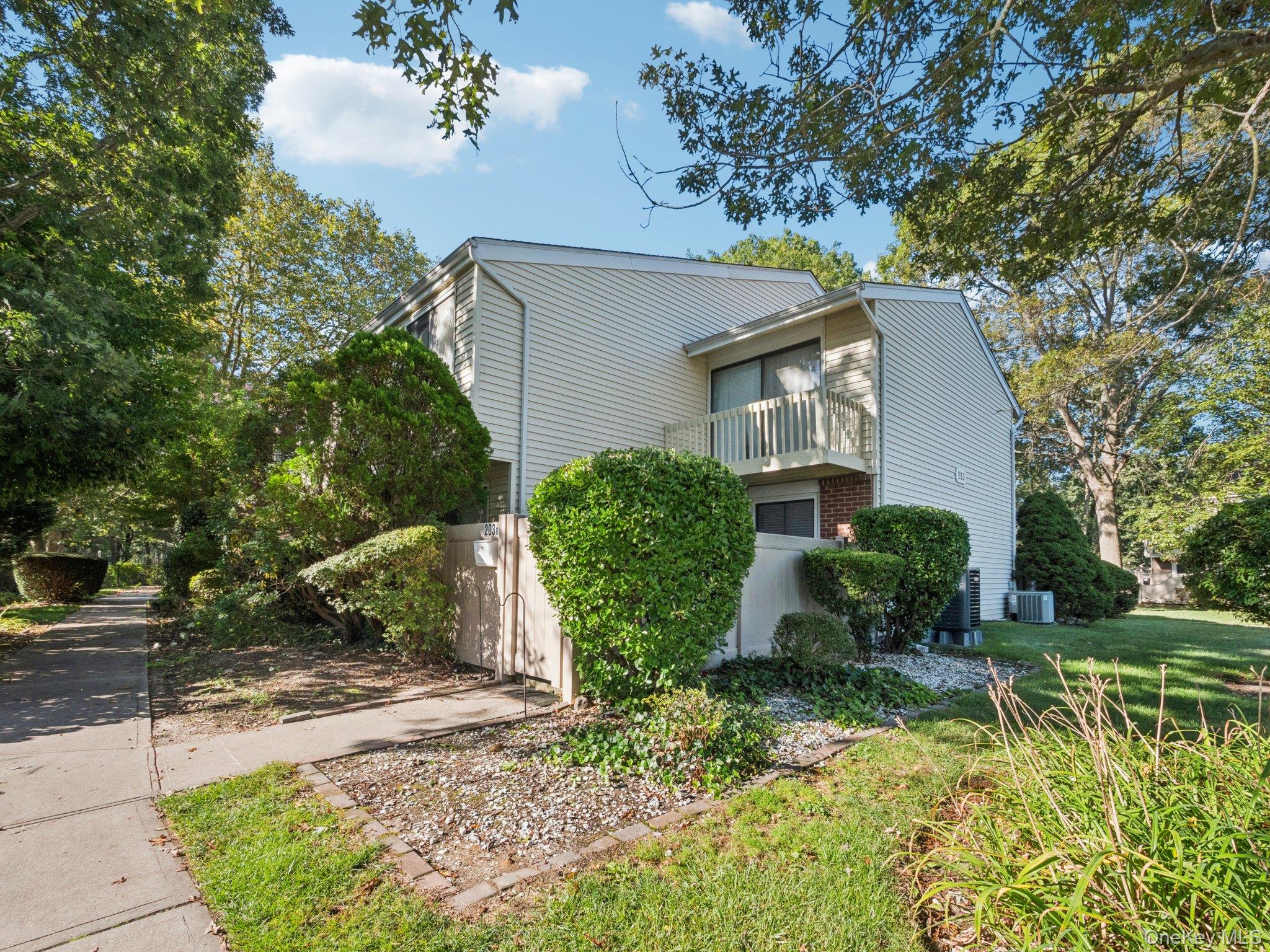 Large corner unit with private fenced patio with newly redone balcony.