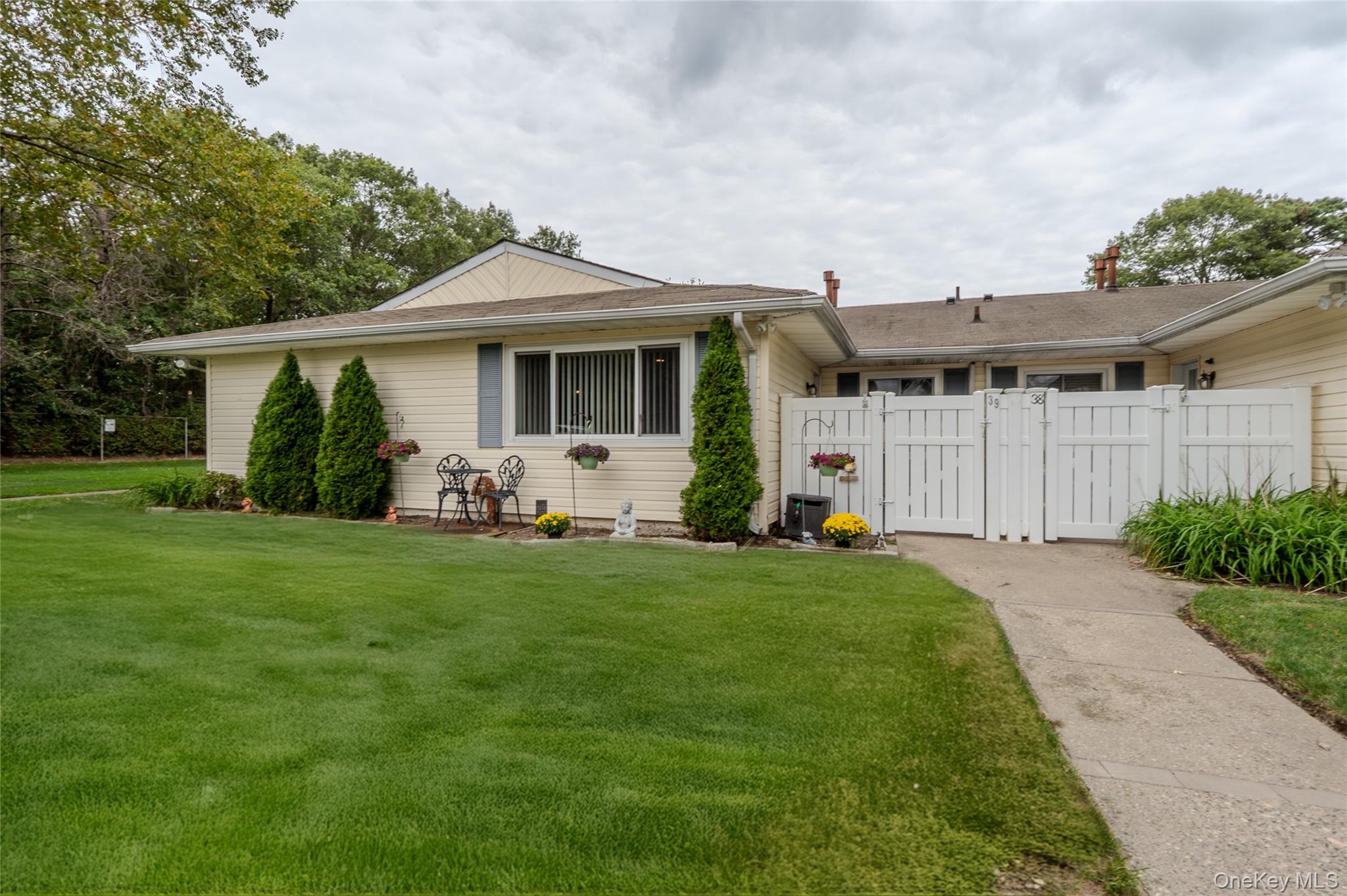 Ranch-style house featuring a gate