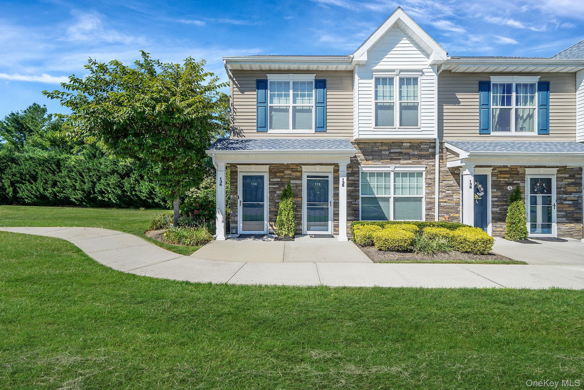 Craftsman inspired home with a front lawn and stone siding