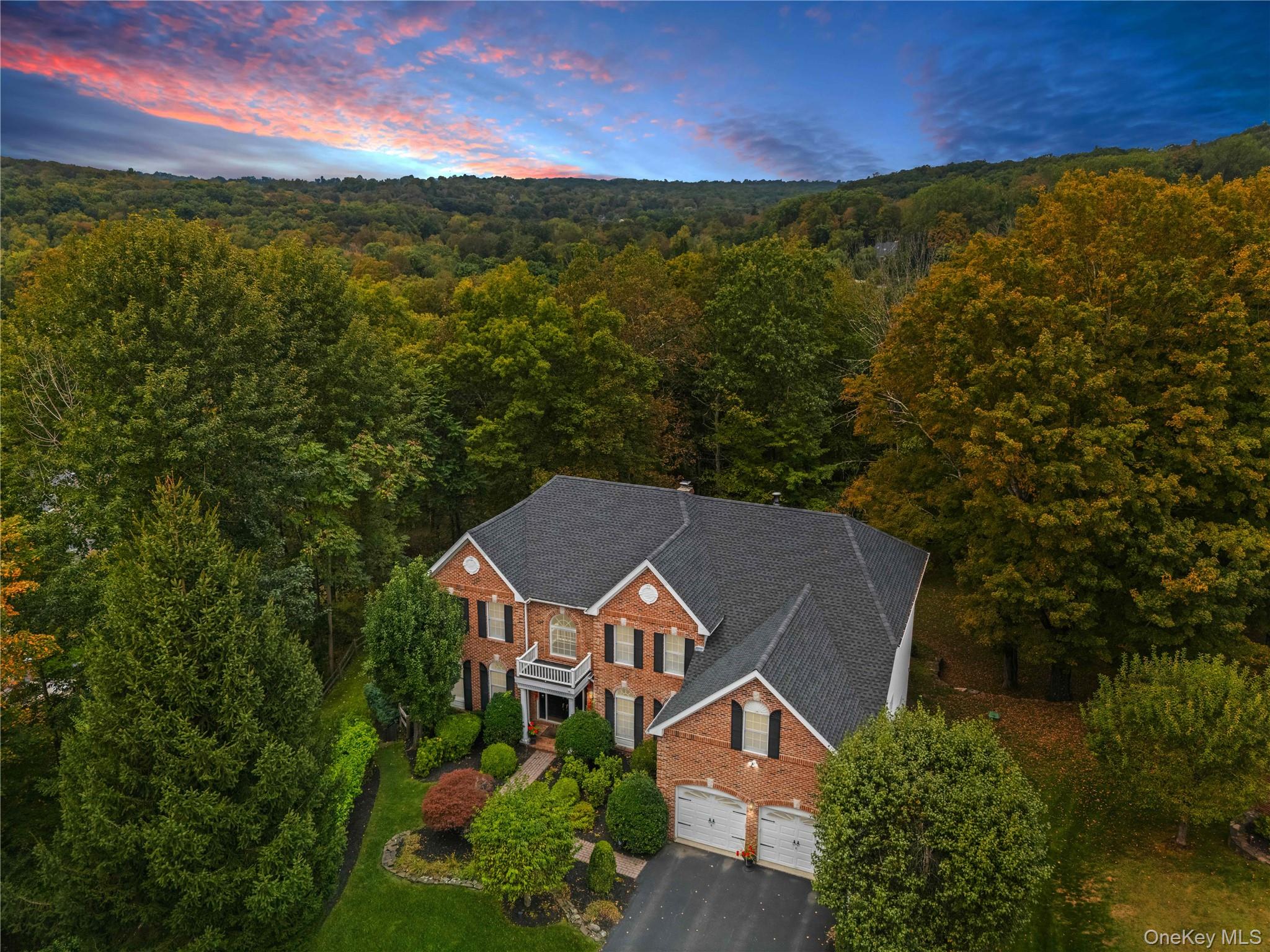 Commanding a high perch at the end of a quiet cul-de-sac, this stately Colonial  makes a grand first impression.