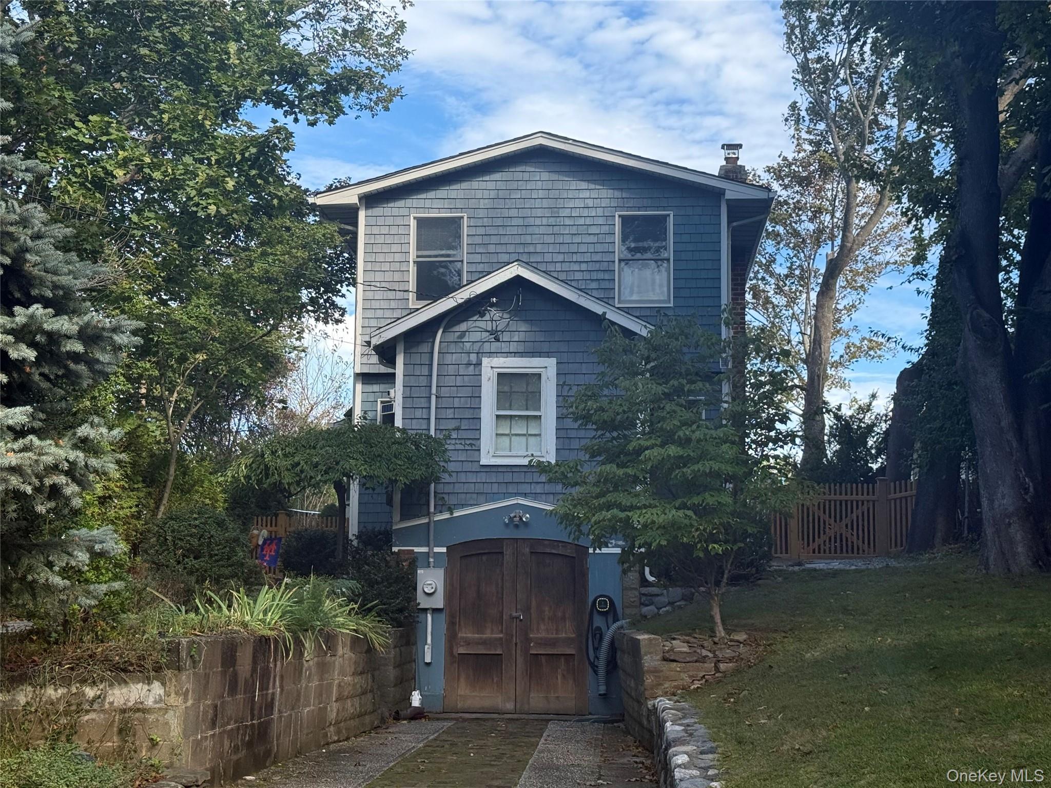 View of front facade with a chimney