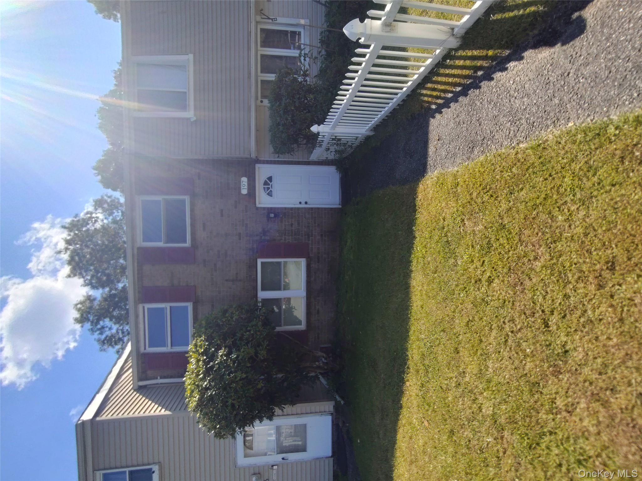 Traditional-style house with brick siding