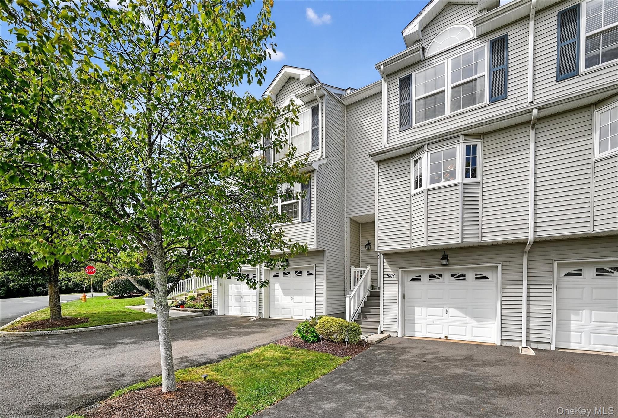 View of front of house featuring driveway and an attached garage