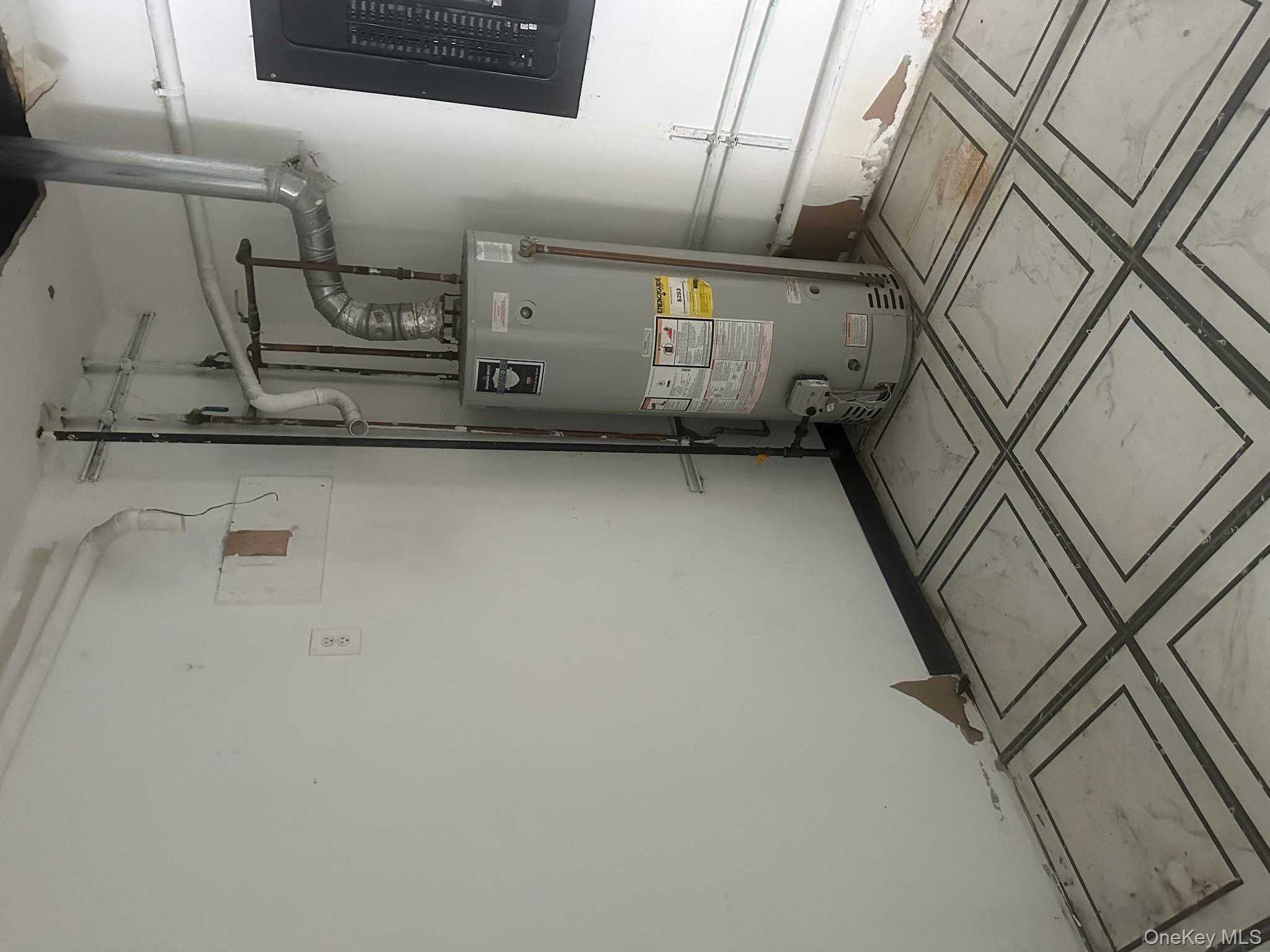 Utilities featuring gas water heater and electric panel