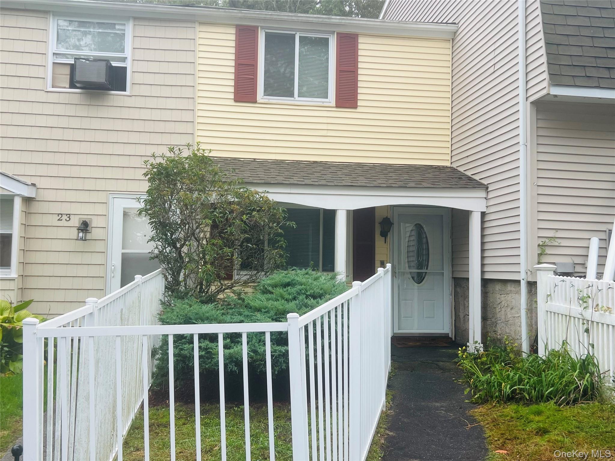 Property entrance with roof with shingles