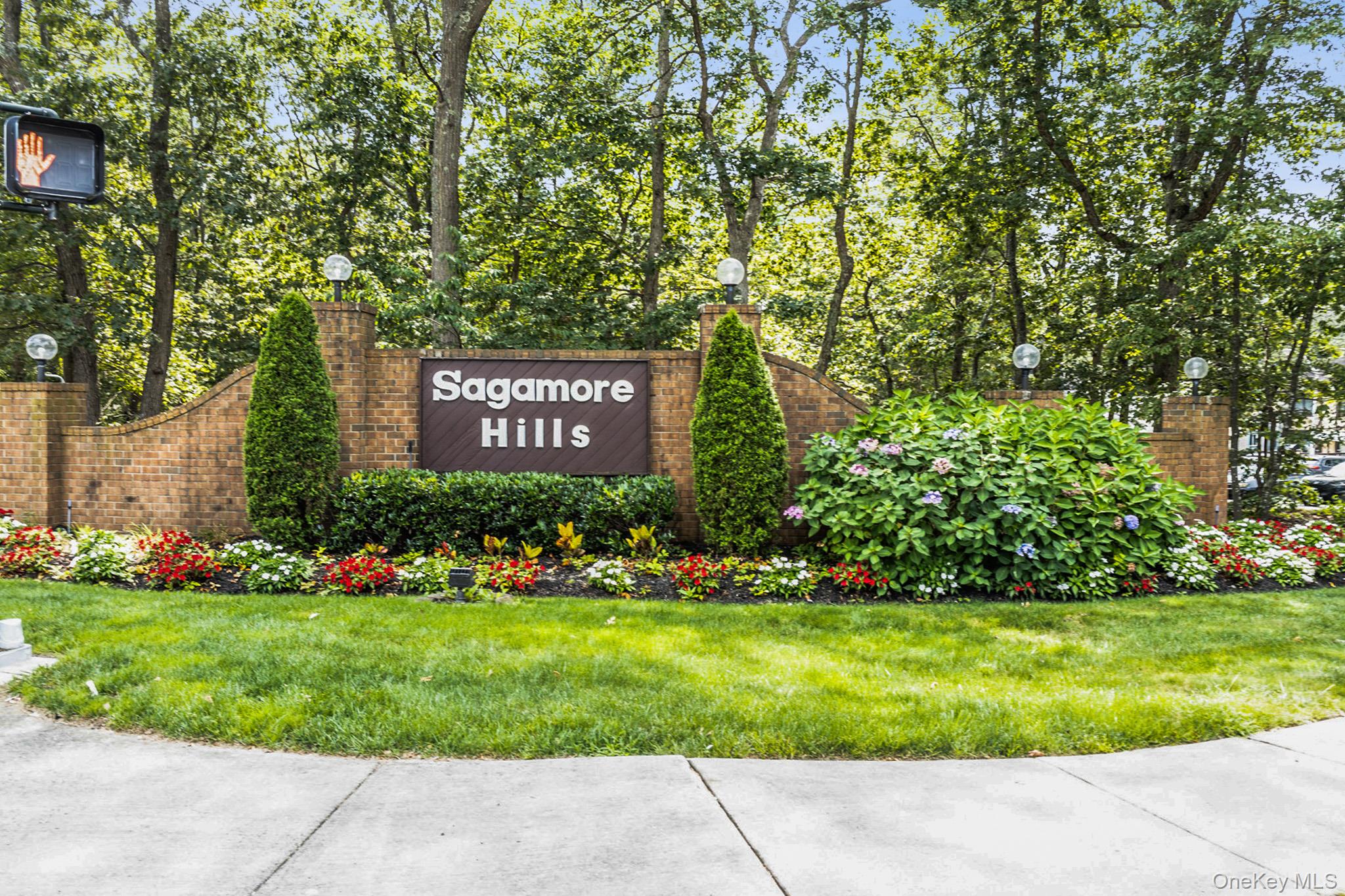 Community / neighborhood sign with a yard