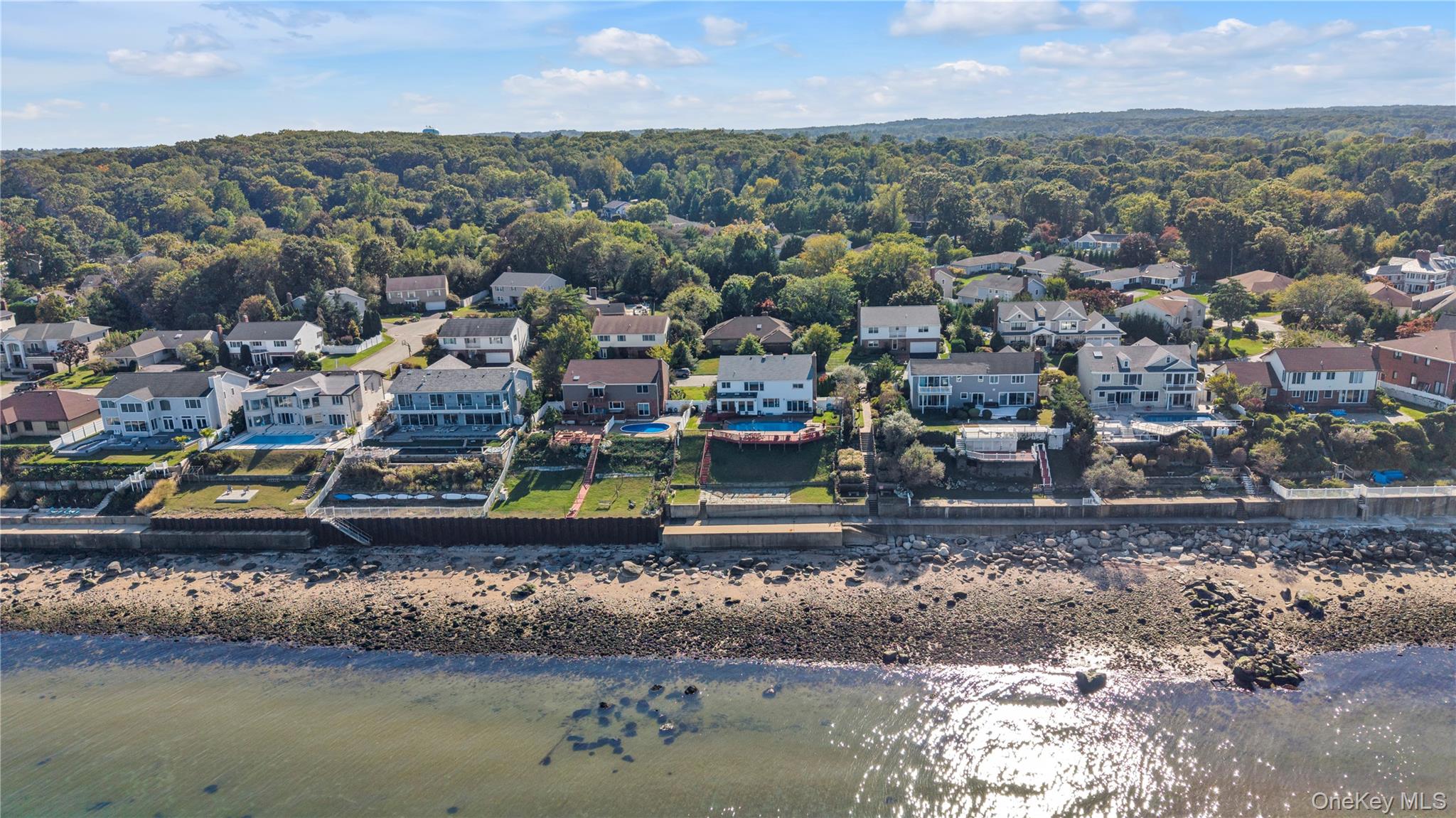 Aerial view of residential area with a nearby body of water