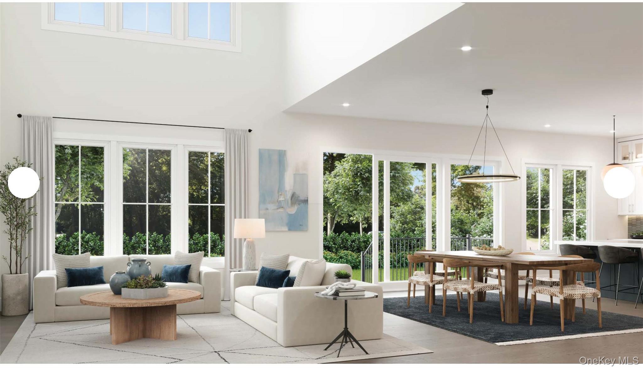 Living room featuring plenty of natural light, light wood-type flooring, and recessed lighting