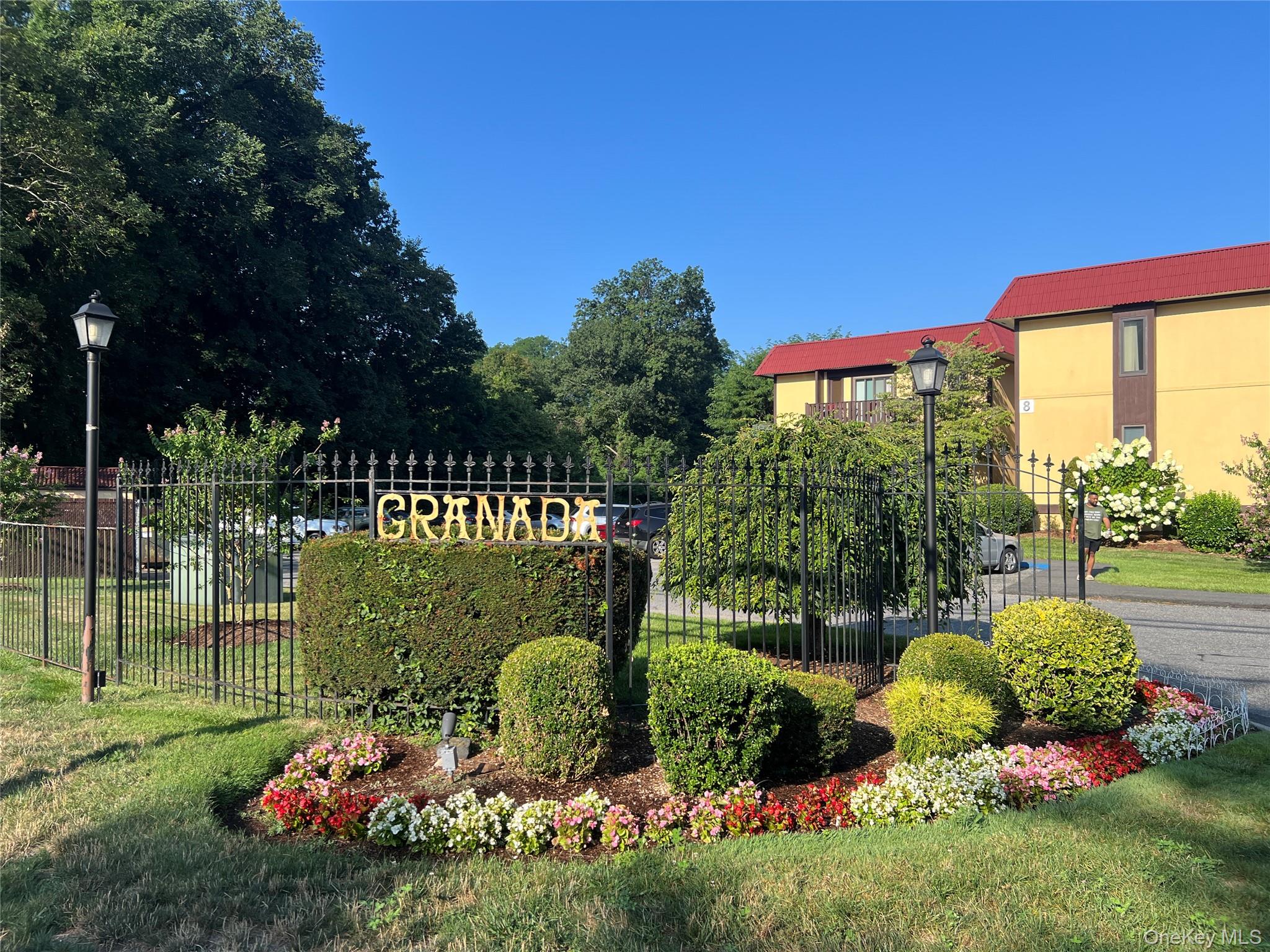 Colorful garden invites you to enter Granada Crescent.