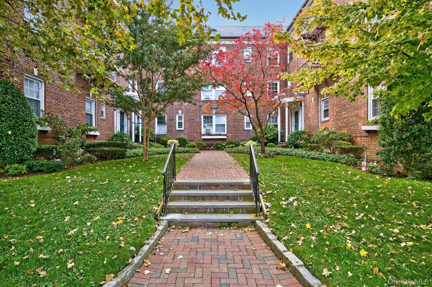 View of property's community featuring a yard